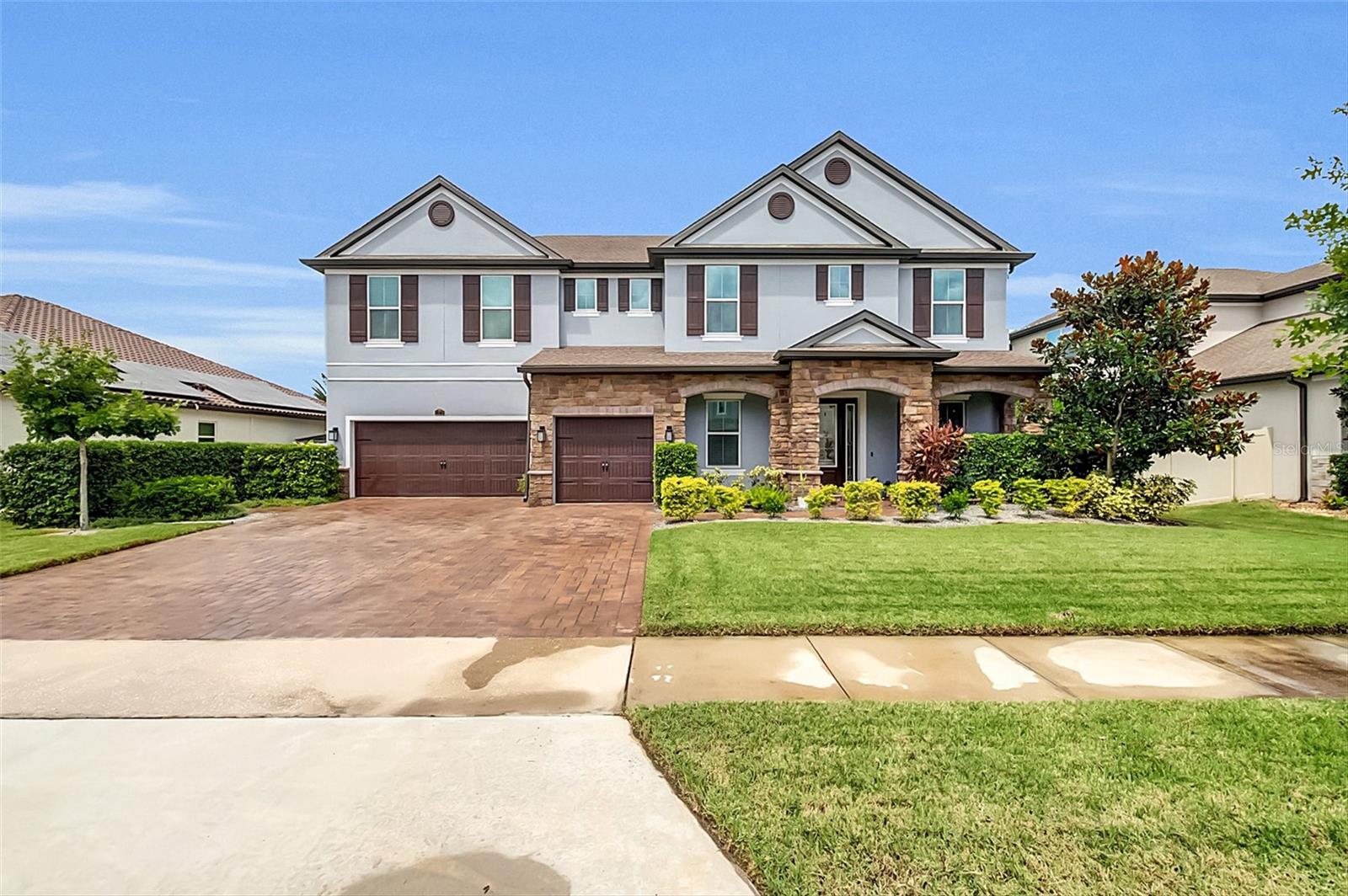 WELCOME HOME: Oviedo Gardens is the Premier Gated Community in Oviedo. This stunning community was built by Meritage Homes, a builder known for quality and energy efficient homes. You will feel at Home the moment you enter the front door and encounter the workmanship and luxurious upgrades that abound in your new executive residence. On the first floor you will discover a bright and open living area ideal for entertaining or relaxing as well as an En-Suite bedroom that would be the perfect in-law or guest suite. Upstairs you will find the huge master suite, 3 other large bedrooms, a movie room and game room. Moving outside, the home sits on a 1/4 acre with a fenced in backyard and a 3-Car garage. Oviedo is a thriving and energetic community just Northeast of Orlando, with easy access to everything Central Florida is famous for! Oviedo Schools are some of the most sought after in all of Florida and Seminole County, just another reason Oviedo is such an attractive place to live! UPGRADES INCLUDE: Gourmet Kitchen with Double Ovens and Level 4 Cabinets, French Doors to Lanai from Cafe, Wet Bar in Game room, upgraded luxury vinyl on 1st Floor, Wrought Iron Railing on staircase, epoxy flooring in garage, 8 ft Doors on 1st floor, upgraded baseboards throughout, Lever Door Hardware throughout and much more. Please check out the 360 Tour and Video.