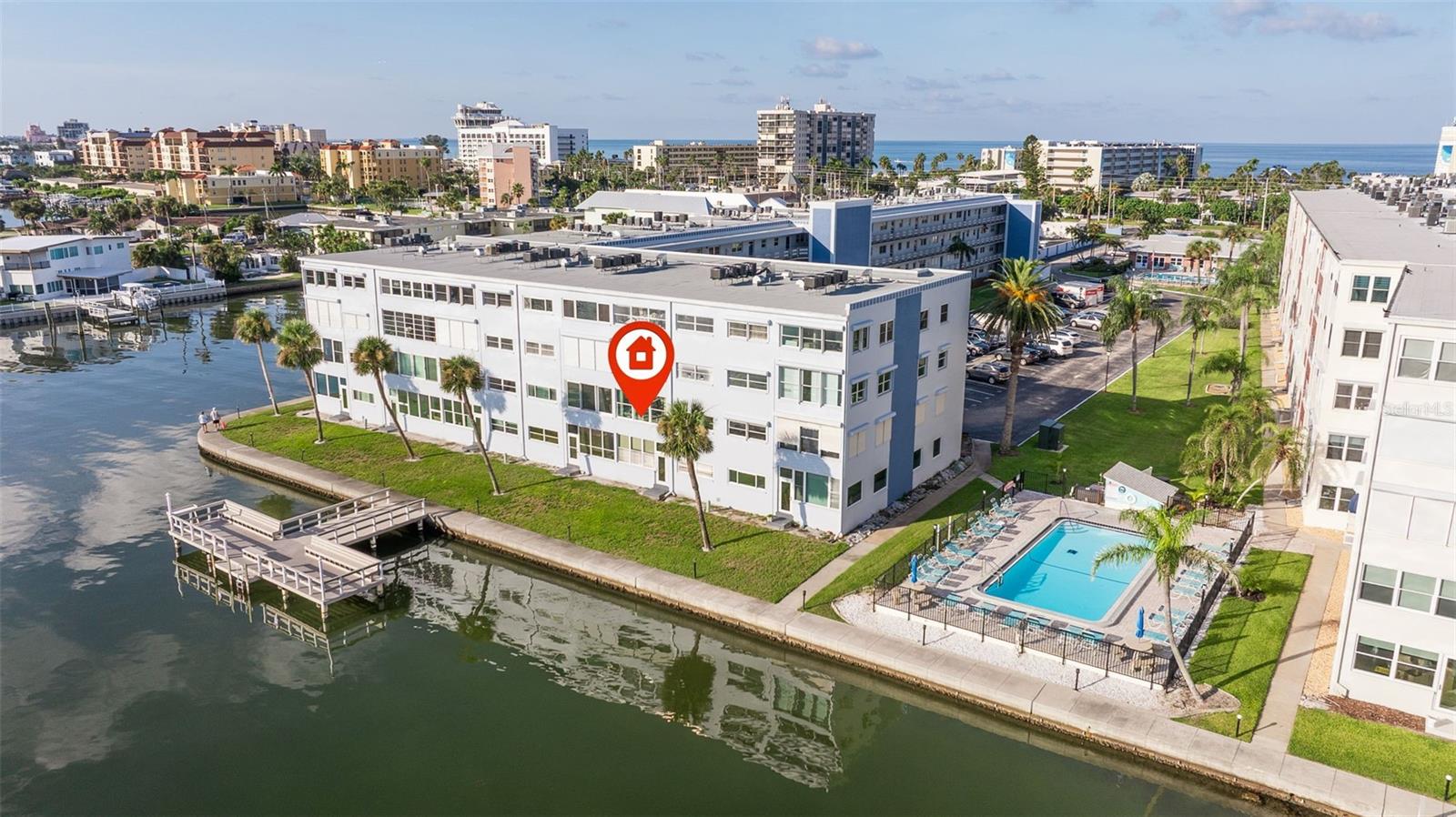 Direct Waterfront Living Across the Street from the Award Winning St Pete Beach! Live everyday like you are on Vacation living in this centrally located property on Gulf Blvd. Walk to the Beach, Restaurants, Beach Bars, Shopping, Local Events and More! Amazing, Unobstructed Boca Ciega Views from your Sunroom and Primary Bedroom! Split Bedroom plan, both with Walk-In Closets. This unit has Hurricane Impact Windows, New HVAC System and New Electrical Panel. Reserved Parking ad Guest Spots. Don't miss out on this opportunity to make this Condo Your OWN! This property was water damaged by Milton from the Roof. Remediation was done down to the Studs, new Drywall was installed giving the right buyer the opportunity to select all of the finishes! The Community boasts Resort-like Living with A Clubhouse, Two Pools, Fitness Center, Shuffleboard, Picnic Area, Fishing Dock, Laundry Facilities, Elevators and Additional Storage. The possibilities are endless!