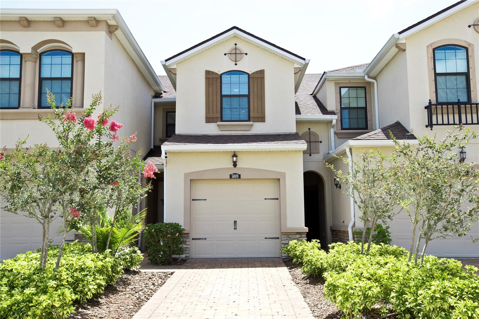 Welcome to this move-in ready townhome located in the desirable Harmony at Lakewood Ranch community. This 3-bedroom, 2.5-bathroom residence, built in 2018, offers 1,512 square feet of thoughtfully designed living space. The open-concept main floor features plank tile flooring, a bright kitchen with tall cabinets, granite countertops and brand new never used appliances. The screened-in covered lanai—perfect for enjoying your morning coffee with no homes behind you.. Upstairs, you’ll find all three bedrooms, including a primary suite with a walk-in closet, as well as a conveniently located laundry room. There is additional storage under the stairs in the pantry. Recent updates include fresh interior paint, new washer, new dryer, new lights and fans, new UV light and ballast in air handler, upgraded garbage disposal, sealed granite countertops, coated garage floor, new kitchen appliances, new vent covers and more.
The property also boasts a brick paver driveway leading to a one-car garage. Residents of Harmony enjoy access to a range of community amenities, including a resort-style pool, fitness center, clubhouse, playground, and maintenance-free lawn care—all for a low monthly HOA fee. Situated in the heart of Lakewood Ranch, this home is close to A-rated schools, shopping centers, restaurants, hospitals, and outdoor recreational trails. Don’t miss the opportunity to make this exceptional townhome your own.