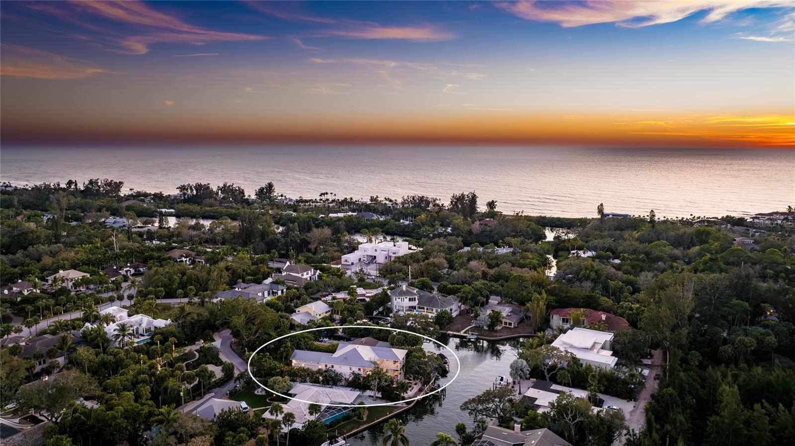 Welcome to 1243 Starboard, where luxury and design converge in a grand, seamless blend. This stunning 4-bedroom + office, 4.5-bathroom home with a 3+ car garage, crafted by the esteemed Voigt Construction, is nestled on nearly half an acre of deep sailboat water on Siesta Key, epitomizing island living at its finest. Constructed to the highest modern standards and equipped with a full-house automatic generator, this home effortlessly withstood recent hurricanes. Encompassing 5,142 square feet of air-conditioned space, it delivers a lifestyle of unparalleled sophistication. The spectacular Great Room is a masterpiece, boasting soaring pecky cypress ceilings and rich mahogany wood floors throughout. At the heart of the home is a chef's dream kitchen with white hardwood cabinetry, pristine countertops, and an expansive island that blends beauty and function. An ocean-inspired blue backsplash adds a coastal touch to this visually stunning and highly functional space. The open-concept kitchen and living room create a versatile floor plan, perfect for both daily living and entertaining. A 220+ bottle wine refrigerator, a gas fireplace, and impact glass sliders seamlessly connect the indoors with the outdoors, allowing you to savor the cool Florida breeze.
The expansive master suite serves as a luxurious escape, featuring a sprawling walk-in closet and a spa-like bathroom with high-end finishes, dual vanities, a soaking tub, and an oversized shower. This serene retreat is a testament to refined living. Each of the additional three bedrooms is designed as a private sanctuary, complete with spacious walk-in closets and en-suite bathrooms, ensuring comfort for every resident.
Outside, embrace the epitome of Siesta Key living. A captivating pool, expansive balcony with water views, and a cozy fire pit create an idyllic haven for relaxation under starlit skies. With deep sailboat water access, a 30,000 lb boat lift, and easy access to the newly opened Midnight Pass for quick Gulf of Mexico access, this property is a dream for boating enthusiasts. Additionally, the full-house generator offers peace of mind, ensuring the home is fully equipped for any unforeseen power outages.
This Siesta Key gem is more than a home; it’s an invitation to experience the elegance and allure of coastal living. Come discover your blend of sophistication and waterfront bliss in this extraordinary residence.