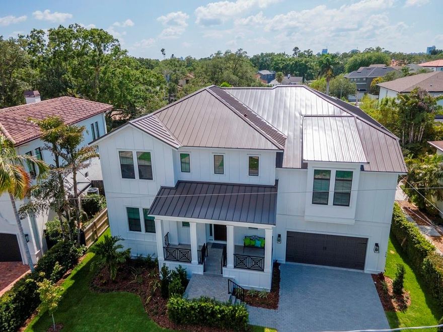 Under contract-accepting backup offers. Why wait for new construction, when you can move right into this brand-new custom-built home on Davis Islands and begin enjoying Island life immediately without the wait? Featuring 5 bedrooms, separate office/den PLUS a bonus (could be converted to a 6th bedroom and bath) this home is open and entertaining, yet comfortable and cozy. The 1st floor living space is a combination of oversized Chef’s delight kitchen with high-end Wolfe &amp; Subzero appliances, loads of cabinetry, center island with double waterfall countertops and an oversized walk-in pantry. Steps from the kitchen is a nicely sized guest suite adjacent to a beautiful full bath, which doubles as a pool bath. The dining/great room are roomy, and both enjoy large slider doors that lead to a beautifully screened oversized lanai and pool. A cheerful office/den is tucked away from the hubbub of the home, providing privacy for the work from home dwellers. Upstairs you’ll find 4 additional bedrooms, each with en suite baths and spacious closets PLUS a terrific mid-level bonus room (with full bath) perfect for teenage hangout space, playroom, workout room, or whatever your imagination can create. The primary suite is positioned completely separate from the additional bedrooms spaces and enjoys 2 walk-in closets, high ceilings, loads of windows and a gorgeous en suite bath with oversized walk-in shower with separate shower heads and controls; deep soaking tub, split sinks with loads of storage. The finishes throughout the home are modern farmhouse with rich, warm hardwood flooring throughout all living areas, loads of beautiful custom moldings and stylish fixtures throughout. Davis Islands offers a small town feel in the heart of everything and includes wonderful parks including a dog beach, boat ramp, the Village with unique shops and tasty dining options, and is a Golf Cart community, making it easy to access all of the islands wonderful amenities. Come on by and for a peek at this beautiful home before it’s too late! Hurry, this won’t last long!