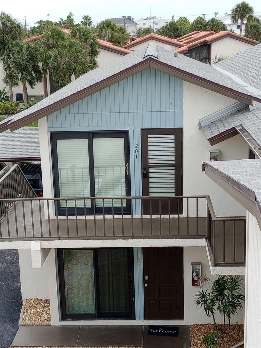 Situated on the second story of a 4 unit building within the complex this Lido Key condo looks and feels like a cozy beach cottage.
Enjoy morning coffee on your south facing balcony. Refresh yourself in the beautiful blue Gulf waters at the end of the street then pop over to the adjacent beach bar for lunch, happy hour, or sunset! Walk (or rent a bike) to nearby St Armands Circle and enjoy its myriad of shopping and (dining choices - day and night.
There's a romantic fireplace (heat optional), a full size W/D, lots of closet space, a carport, and (drumroll)..excellent income potential!
This complex is one of the few on Lido Key that doesn't require long term rentals. It is very popular on Airbnb with many guests returning regularly (not just snowbirds).