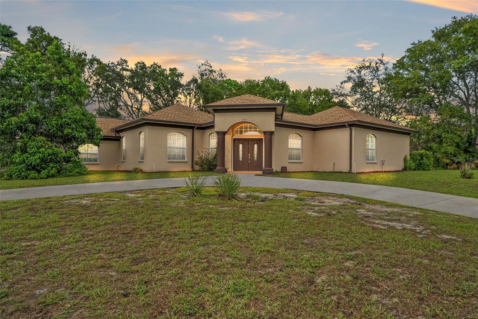 Welcome home! This cabana home features an oversized lot with a double driveway to a double door entry. Enter into your Florida paradise. Covered entry so don't worry about the rain when coming home. Large lanai with pool views from around the home. The split floor plan is perfect for your older children, in-laws or visitors. This home boasts tall ceilings, fans, tile and an open kitchen with extra storage. The kitchen, laundry room and master bath have all been remodeled and updated. Roof is only 5 years old and a/c is just 2 years old. It is definitely a must see so make your appointment today!