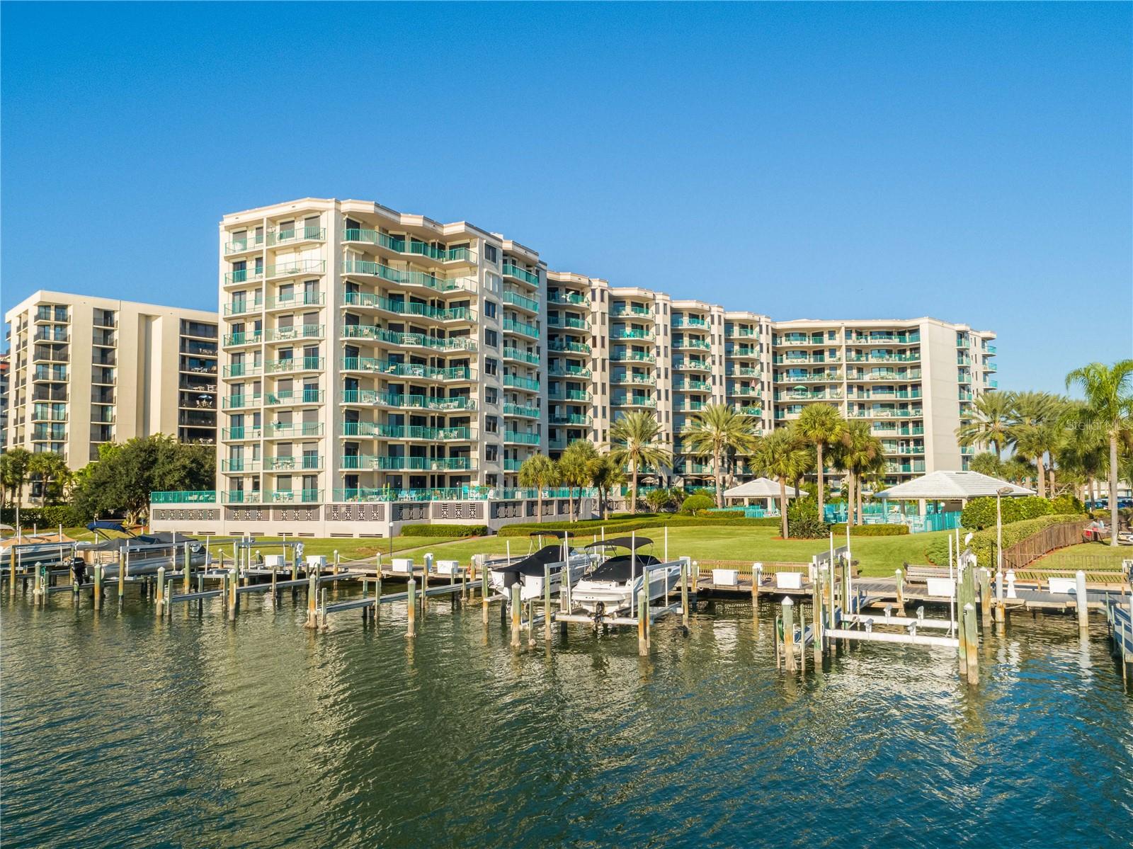 WATERFRONT PRICED TO SELL. Not too often do units come for sale in this sought-after well-maintained building . Spacious 1640sft 2bdrm 2 full baths offering DOUBLE BALCONIES. The Master ensuite offers> Double Door entry, Balcony, bathroom with double vanity, garden tub, separate shower, water closet, and impressive sized California style walk-in closet,. Covered assigned under building secured parking #25. This East facing unit with DOUBLE BALCONIES offers VIEWS OF THE INTRACOASTAL WATERWAY from the living room, kitchen, and both bedrooms! NEW interior paint, NEW flooring, NEW ceiling fans, LARGE OPEN KITCHEN with a separate eating area. The building has passed all Florida requirements of building inspections. MILESTONE AND SIRS STUDIES ARE COMPLETED AND FULLY FUNDED. THE BUILDING ROOF IS NEW, giving assurance for many years. The monthly maint fee of $1077. Includes; Cable TV, Common Area Taxes, Community Pool, Insurance, Internet, Maintenance Exterior, Maintenance Grounds, Manager, Pest Control, Pool Maintenance, Sewer, Trash, Water. SUNWATCH HAS BEAUTIFUL AMENITIES amongst an all-NEW BEAUTIFUL LOBBY INTERIOR REMODEL. (secured lobby entrance) The Sunwatch community amenities include- 2 Heated swimming pools, hot tub with outside bathrooms, covered areas, 2 Tennis courts, a pickle ball court(s), BBQ grills, fitness room, community room, Boat Slips (when available) and best of all, 2 Guest suite units to reserve for the Owners guests to stay. The waterfront community of Island Estates has all you will need at your fingertips--grocery, gas station, UPS/postal, fine and casual dining, ER clinic and more. THIS FRIENDLY COMMUNITY OF ISLAND ESTATES HAS EVERYTHING TO LOVE ABOUT IT!