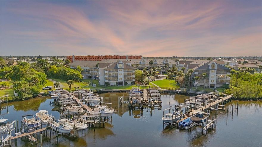 One or more photo(s) has been virtually staged. Ready to live the waterfront dream? This rare top-floor condo comes with a deeded boat slip and 10,000LB lift, plus access to a private beach in one of the area’s most sought-after boating communities. Inside, you’ll find 3 bedrooms, 3 baths, cathedral ceilings, skylights, and gorgeous views of the pool and lush gardens. The open kitchen shines with granite counters, stainless appliances, a breakfast bar, and pass-through window. Upstairs, the loft is your flex space—third bedroom, private retreat, or sunset lounge with ensuite bath and walk-in closet. You’ll love the covered parking, generous storage, and resort-style perks like two pools, boat ramp, tennis, pickleball, and more. HOA covers cable, internet, trash, sewer, pest control, and exterior maintenance. Motivated seller—bring all offers! Priced to personalize and packed with potential, this one’s a rare catch.