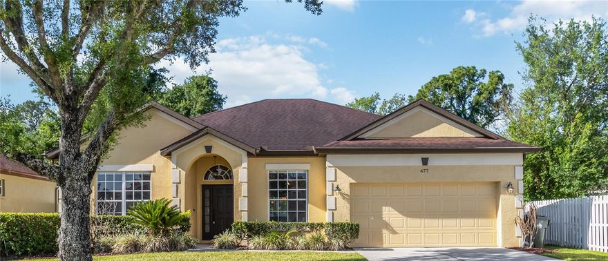 Available for the first time since it was built, this beautifully maintained residence in the sought-after Hampton Woods of Wesmere reflects exceptional pride of ownership. Set within a gated community with two entrances and backing to conservation with no rear neighbors, the home offers a sense of privacy and calm that is increasingly hard to find. Inside, the flexible layout is both functional and inviting, with soaring ceilings, graceful arched details and brand-new flooring with no carpet throughout. This four-bedroom, two-bath residence, offering versatility for guests, a home office or additional living needs. Formal living and dining spaces feel open and welcoming, equally suited for entertaining and everyday living, while natural light fills the home’s interior. The kitchen has been tastefully updated with stone-inspired countertops, a classic subway tile backsplash, stainless steel appliances and an ample breakfast area. The primary suite is a comfortable retreat, complete with dual vessel sinks, a soaking tub and a separate shower. One of the home’s most special spaces is the expansive glass-enclosed veranda. Professionally constructed with a reinforced structural beam and double-pane insulated windows, it extends the living experience in a way that feels both elegant and relaxed, overlooking the fenced backyard and tranquil conservation beyond. Practical updates add confidence, including a roof replaced in 2018 and a 2022 air-conditioning system. An attached two-car garage and one of the longest private driveways in the community add to the home’s everyday ease. All of this is set within a gated neighborhood with two guarded entrances, just minutes from Winter Garden Village, Windermere and major access routes including State Road 429, State Road 408 and Florida’s Turnpike. Public records reflect three bedrooms and two baths. Buyer to verify all room dimensions, permitted uses, bedroom count and total living area.