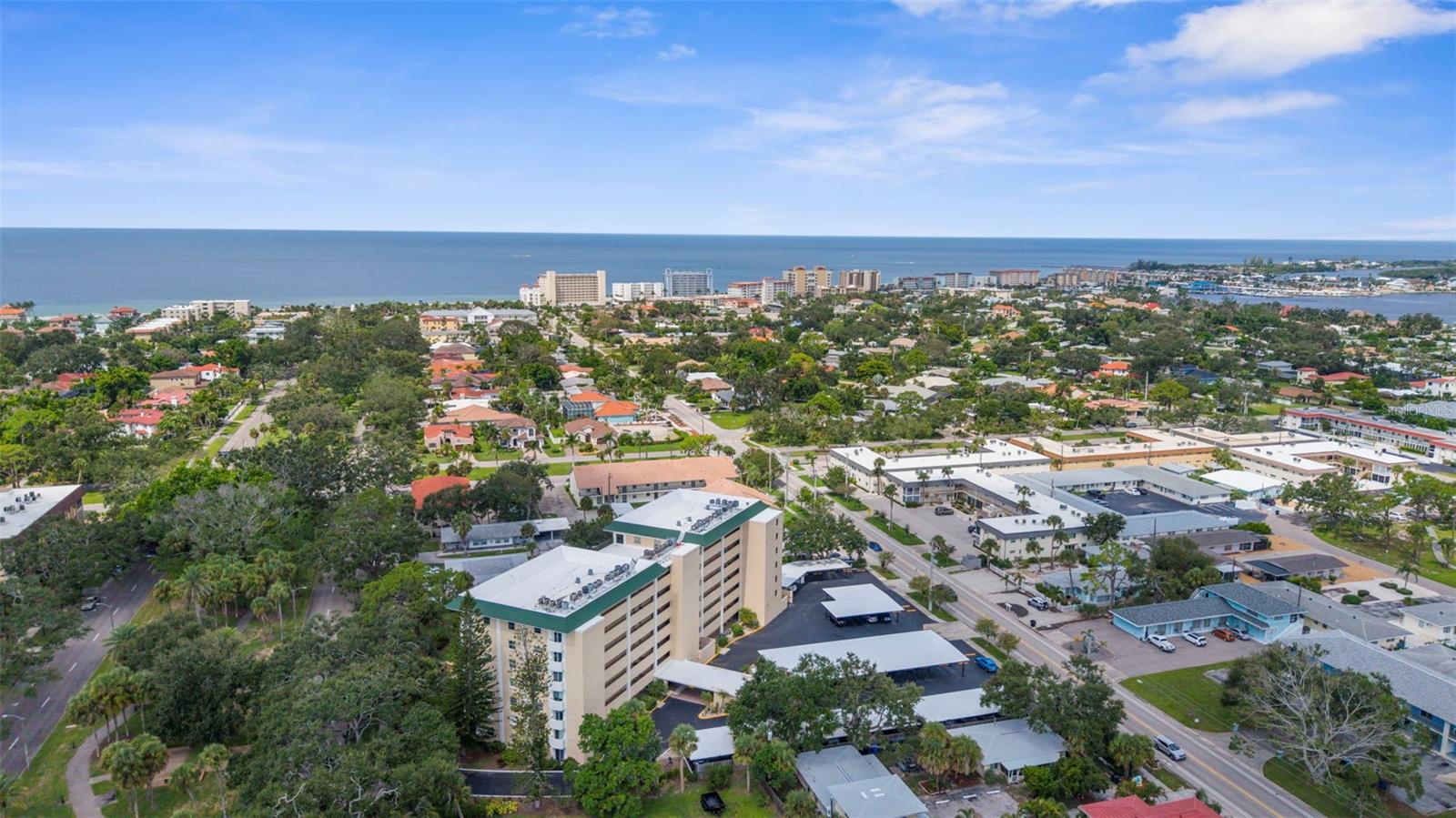 Experience carefree living in the heart of Venice. This stunningly updated condo offers the rare combination of a secure, well-run community, a convenient ground-floor location, and an incredible walkable lifestyle. The association has maintained stable costs, keeping up with regular maintenance and state inspections. This means you can buy with confidence and embrace the true Venice lifestyle from day one. A new roof project was recently completed, adding to the list of building improvements that include a resealed parking lot (2023), fresh paint (2023), and updated elevators (2021). Plus, your new home is situated in a lower-risk Flood Zone X, providing solid insurance options.
This rare, ground-floor unit offers true convenience: no stairs or elevators! It’s just steps from the community's heated, screened-in pool, lobby, and club room, yet its location offers a secluded escape with private, tranquil views of lush tropical gardens.
Inside, the 2-bedroom, 2-bath floor plan flows effortlessly, defined by custom built-ins and premium porcelain tile throughout. The kitchen and both bathrooms have been updated with new quartz counters. A new GE refrigerator and range (2024), a newer dishwasher (2023), and a new water heater (2024) ensure a worry-free experience. With a newer AC (2022) and impact-resistant glass sliders, you can enjoy year-round comfort and peace of mind.
You cannot beat this location! From your doorstep, you can walk to pristine beaches, the Venice Farmer's Market, and the shops and restaurants of Historic Downtown. Discover the tranquil trail among the Banyans and enjoy easy access to nearby Centennial Park for concerts and events, or Hecksher Park for tennis, basketball, and pickleball.
The active 55+ community at Venice Avenue Condominium provides a full schedule of social activities. This unit is immaculately maintained, and ready for you to move in. This is your chance to own a piece of paradise. Schedule a private showing and make it yours.