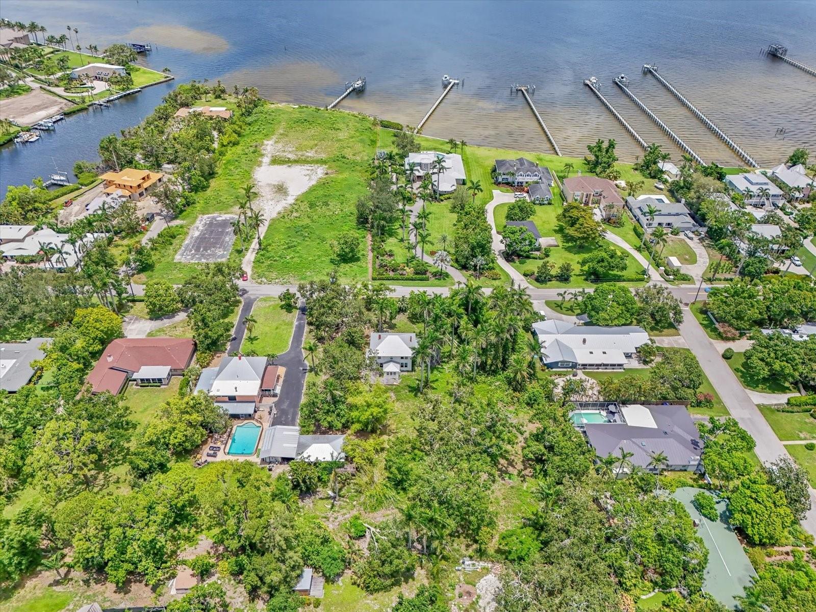~BUILD YOUR OWN DREAM ESTATE with this prime opportunity in the heart of West Bradenton's River District. Combine convenience with endless possibilities on this large approx. .69-acre (half of the current 1.38-acre) parcel. Located on desirable Riverview Boulevard along the Manatee River this vast approx. 29,000 SqFt. (half of the current 60,000 SqFt.) lot has so much potential. Lush and lined with gorgeous mature trees and beautiful royal palms this property is rich in history and would make for an extraordinary family estate. Enjoy easy access to downtown, waterfront dining, and the stunning beaches of Anna Maria Island. Lewis Park is also nearby, and St. Stephen's School is just a block away. Bring your vision to life. **Property is currently in the process of being divided, this is for the vacant lot EAST, of the home**
The home itself is also for sale listed as residential on a separate listing. Do not miss out on creating your perfect residence in this wonderful community!