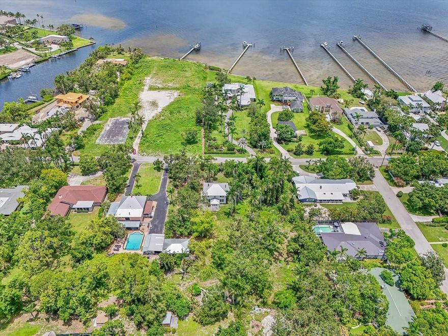 ~BUILD YOUR OWN DREAM ESTATE with this prime opportunity in the heart of West Bradenton's River District. Combine convenience with endless possibilities on this large approx. .69-acre (half of the current 1.38-acre) parcel. Located on desirable Riverview Boulevard along the Manatee River this vast approx. 29,000 SqFt. (half of the current 60,000 SqFt.)  lot has so much potential. Lush and lined with gorgeous mature trees and beautiful royal palms this property is rich in history and would make for an extraordinary family estate. Enjoy easy access to downtown, waterfront dining, and the stunning beaches of Anna Maria Island. Lewis Park is also nearby, and St. Stephen's School is just a block away. Bring your vision to life. **Property is currently in the process of being divided, this is for the vacant lot EAST, of the home**
The home itself is also for sale listed as residential on a separate listing. Do not miss out on creating your perfect residence in this wonderful community!