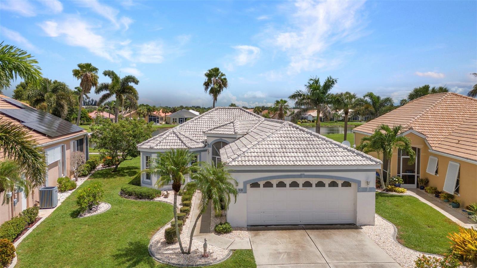 Welcome to Seminole Lakes, one of Punta Gorda’s most desirable guard-gated golf communities! This beautifully maintained, one-owner home offers 2 bedrooms, 2 bathrooms, and a 2-car garage with 1,278 sq. ft. of comfortable living space. Recently updated with new carpet and fresh interior paint, this home features a split floor plan with high ceilings, an open layout, and plenty of natural light. Enjoy a spacious living room, dedicated dining area, and a cozy dinette off the kitchen—plus sliders from the living room, kitchen, and primary suite all leading to the screened lanai with peaceful lake and golf course views. The primary suite includes a walk-in closet, private bath, and serene water views.
Community amenities include an executive 18-hole golf course, clubhouse, community pool, bocce ball, fitness center, tennis, and pickleball (with optional memberships). With low monthly fees and HOA services covering common area maintenance and more, you’ll love the ease of living here. Ideally located near shopping, dining, historic downtown, and with quick access to US-41 and I-75, this home is perfect as a full-time residence or seasonal retreat.