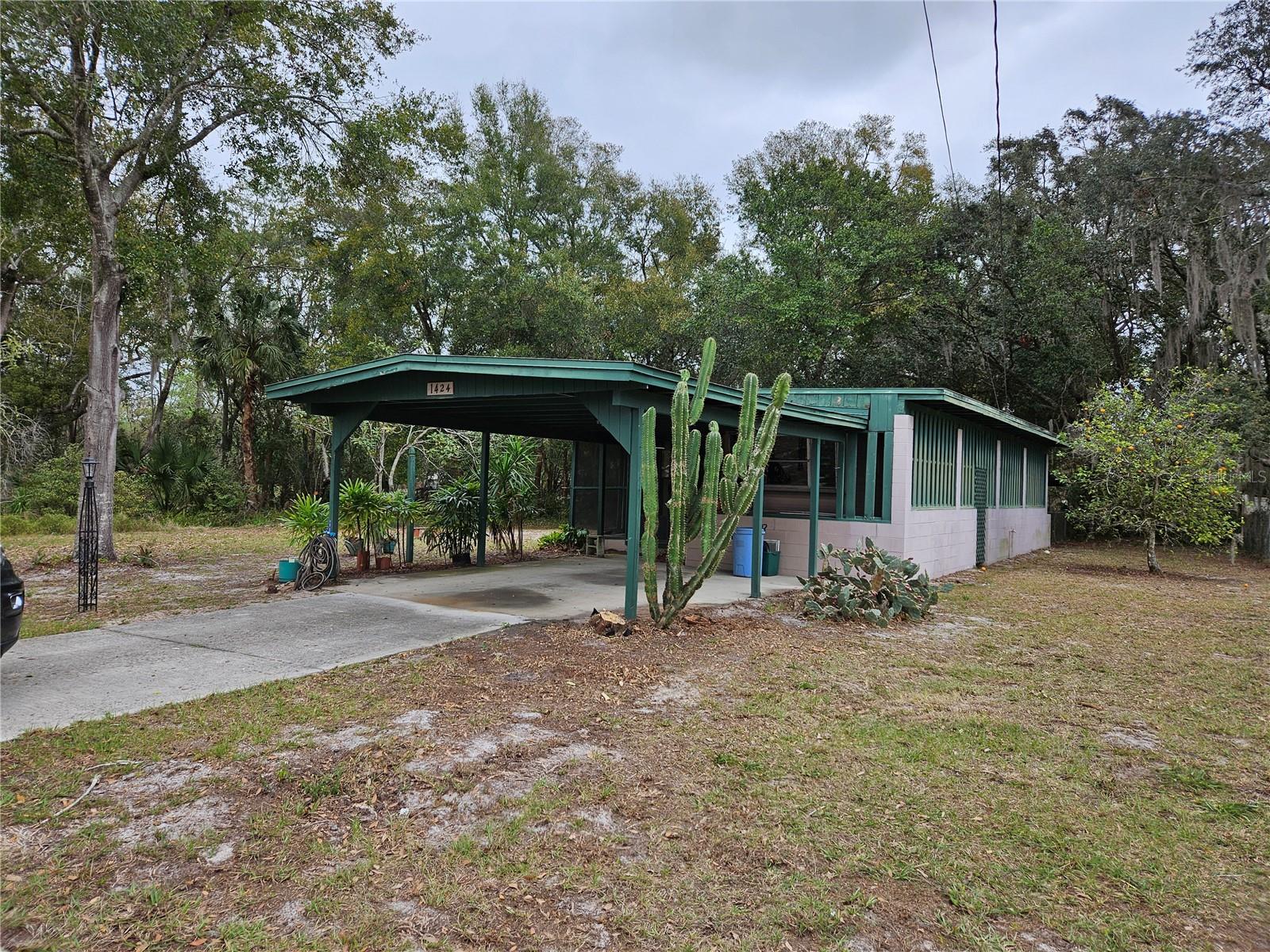 This "AS IS" home is very unique; it is part mobile within an attached addition with a roof over. It has 2br 1 large bath, with a large porch in front and rear. There is a spacious inside laundry room with laundry sink. This home is very clean and move in ready! Great starter home or rental investment. This home has a large, oversized lot .35 of an acre, with lots of privacy on a horseshoe type street. There is a small, fenced area in the rear. This home has a lot of potential, or you can build your dream home in the future. Although everything is older, everything works, and it is cute and quaint. Central Air/Heat and has city water/sewer. This home is in the heart of Casselberry, close to all amenities. Large carport in the front of the home and a covered storage area on the side attached. Very quiet, nice well-established neighborhood with mixed single-family homes and mobile homes. This home is considered real property and goes with the land. NO HOA. If you want room to breathe, quite, private, out of the way yet close in, this is FOR YOU! CALL FOR SHOWING