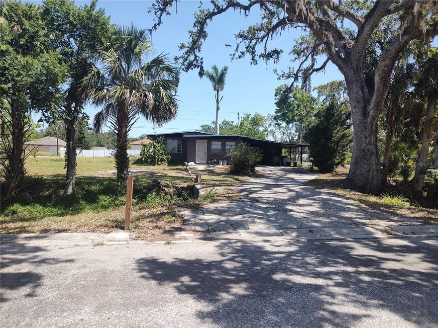 This 1,390 s/f home is on a .7625 acre lot with NO HOA in Bradenton, FL. Definitely worth looking at. FHA Financing with 203k loan is the way to go or cash. Welcome to this residence. This home offers a perfect blend of comfort and convenience, making it an ideal choice for families and individuals alike. Main side of home features 2 bedrooms, 2nd bedroom has no closet, 1 full bathroom, living room, kitchen, dining area and large front room. Studio side of the property has two separate entrances with a full bathroom. Carport accommodates 2 cars. Enjoy an open-concept floor plan that seamlessly connects the living, dining and kitchen areas, providing space for relaxation and entertaining. Home sits on .7625 acres, that's a nice bonus, and NO HOA or CDD fees! Updated kitchen with plenty of cabinetry and a functional layout, making meal preparation a breeze. Updated main bathroom and comfortable bedrooms. Outdoor living: Step outside to a large yard, perfect for outdoor activities, gardening or simply relaxing. Situated in a neighborhood with close proximity to local amenities, schools, shopping centers, and dining options, ensuring convenience. This property offers the perfect foundation to create lasting memories. Don't miss out on this great deal of a home. Call for your private showing now!