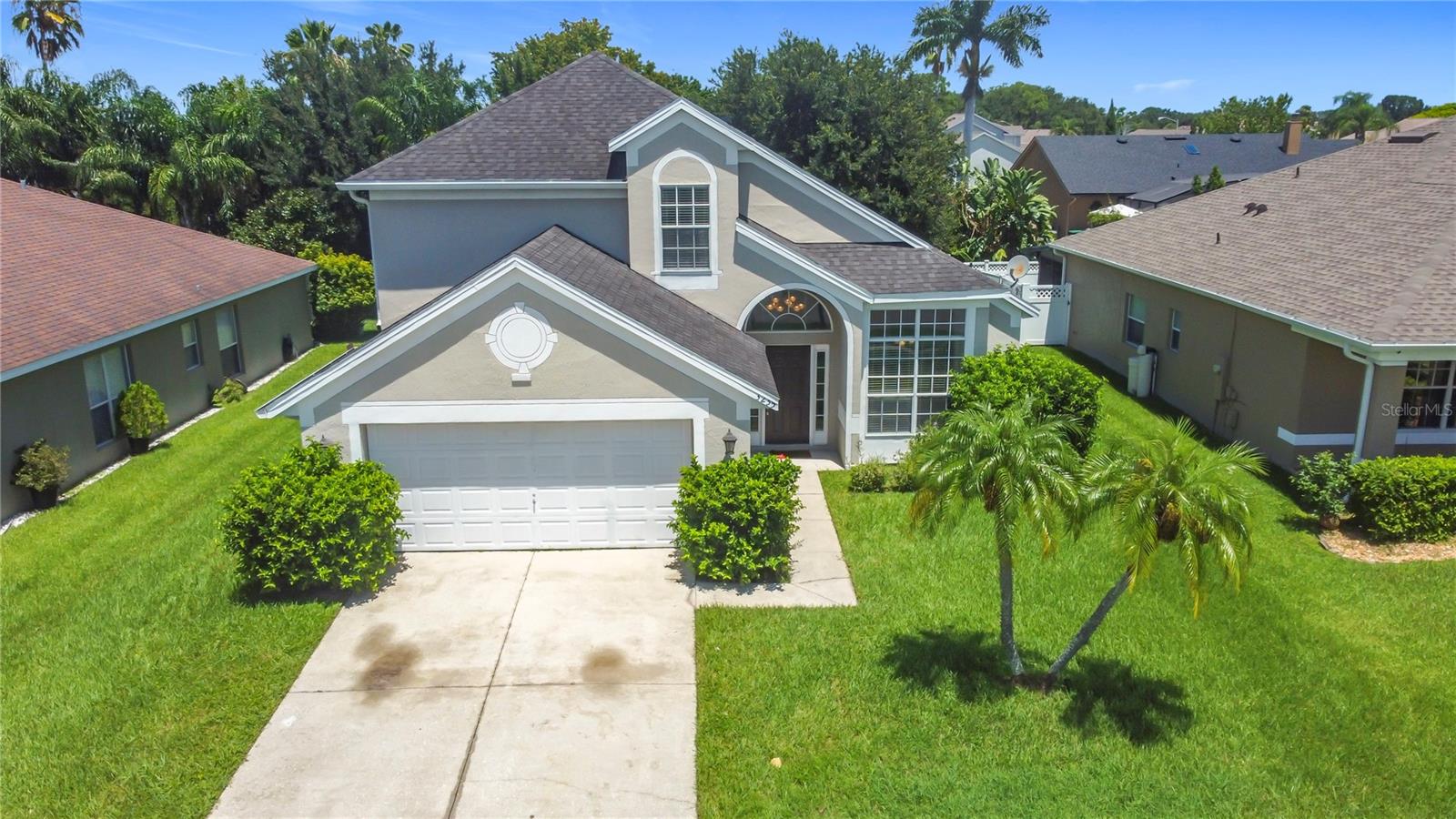 Three bedrooms, 2.5 bathrooms plus LOFT 2 story home with 2 car garage in desirable Herons Landing adjacent to Hunters Creek and The Loop shopping center with lots of restaurants, shopping, and entertainment. Great location as Disney World, major highways, and more attractions nearby ! Home features open floor plan with very high ceiling in living room and large window for plenty of natural light, combo living room/dining room, eat in area in kitchen, master bedroom on 1st floor, covered patio. laminate floors throughout and tile in bathrooms and kitchen. Brand new stainless steel appliances in kitchen ! The 1st floor master bedroom has a spacious bathroom with garden bath and separate shower, dual sinks, private toilet area, and large walk in closet. The multi functional loft could be used as a playroom, office, exercise room, or for guests. There is a community pool, walking trail, park, and playground, all maintained by HOA. LOW HOA fees and no CDD fees !