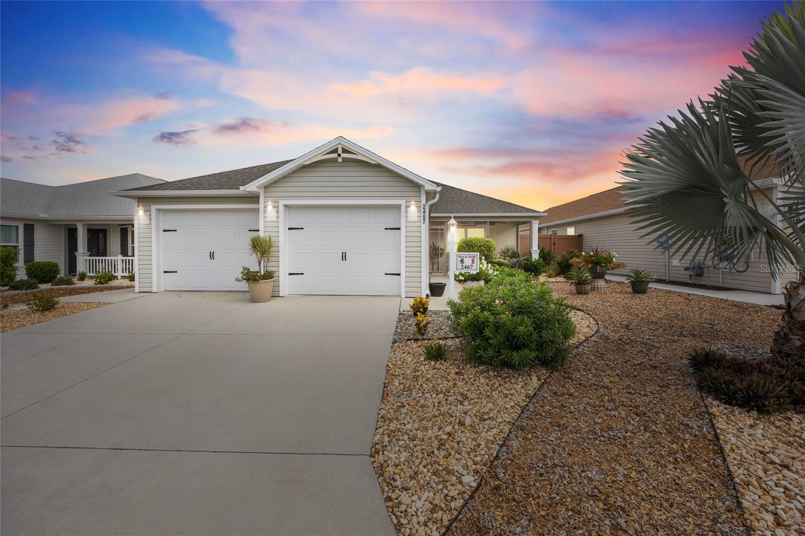Welcome to this beautiful Melrose model villa in the Village of DeSoto! If you are ready to move to The Villages, this villa is a must see. Not only is it perfectly maintained but it’s in a fantastic location. It’s minutes from Magnolia Plaza, the new Eastport Town Square, and Brownwood Town Square.
This 3 bedroom, 2 bath home is filled with thoughtful upgrades and stylish details throughout. From the moment you arrive, you’ll appreciate the enhanced landscaping with stone and mulch and the screened entry creating a welcoming front lanai with dual ceiling fans as well as the LED soffit lighting.
Inside, the open floor plan features vaulted ceilings, crown molding, plantation shutters, and ceiling fans in every bedroom. The sliders open to a screened lanai overlooking a private yard—perfect for pet lovers or outdoor enjoyment. Freshly painted in designer colors. The flow of this open living area is perfect for entertaining. Large, bright and, inviting.
The spacious kitchen boasts gas appliances, a walk-in pantry, and abundant cabinet and counter space, ideal for both everyday meals and entertaining. Not only is the kitchen open to the dining area but it also has bar area, perfect for overflow seating. The master suite offers a tray ceiling accented with crown molding and color, private bath, double vanity, a Roman walk-in shower, and walk in closets.
Guests will enjoy two comfortable bedrooms, with one featuring a custom built-in office workstation. A second full bath adds convenience.
Additional highlights include gas heat, a full 2-car garage, and dual fans on the front lanai for year-round comfort.
This villa is the perfect blend of beauty, functionality, and low-maintenance living—all in a fantastic location close to the best of The Villages lifestyle! Realtor is the owner.