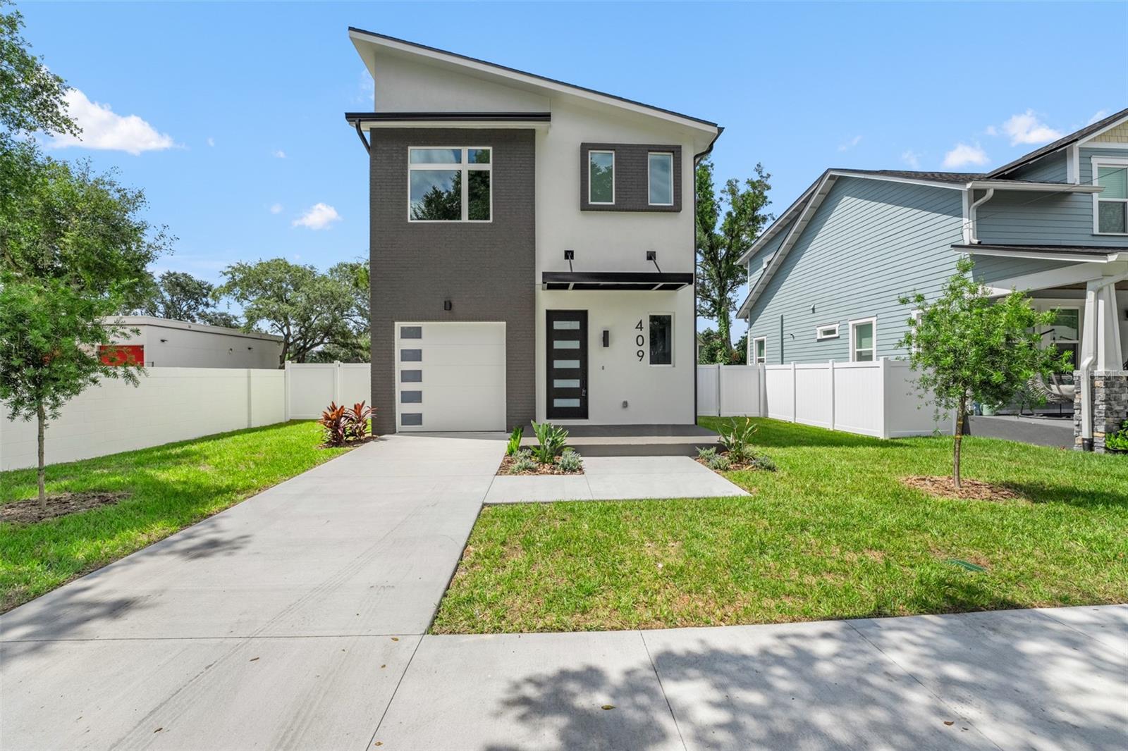 Welcome to the sixth and final home in an exclusive six-home modern development by VIKIN Homes, located in the heart of vibrant Tampa Heights. This brand-new residence features 4 spacious ensuite bedrooms along with a half bath, offering both privacy and luxury for every member of the household or guest. Thoughtfully designed with clean, modern lines, the home showcases quartz countertops, custom cabinetry, and bold industrial-style awnings. High-performance features like spray foam insulation and hurricane impact windows ensure long-term comfort, efficiency, and peace of mind. Additional highlights include a single-car garage and a 10-year builder warranty, offering added value and confidence in your investment. Located just minutes from Armature Works, Riverwalk, and Downtown Tampa, this home blends cutting-edge design with unbeatable urban convenience. Don’t miss your chance to own a piece of this one-of-a-kind development in one of Tampa’s most sought-after neighborhoods.