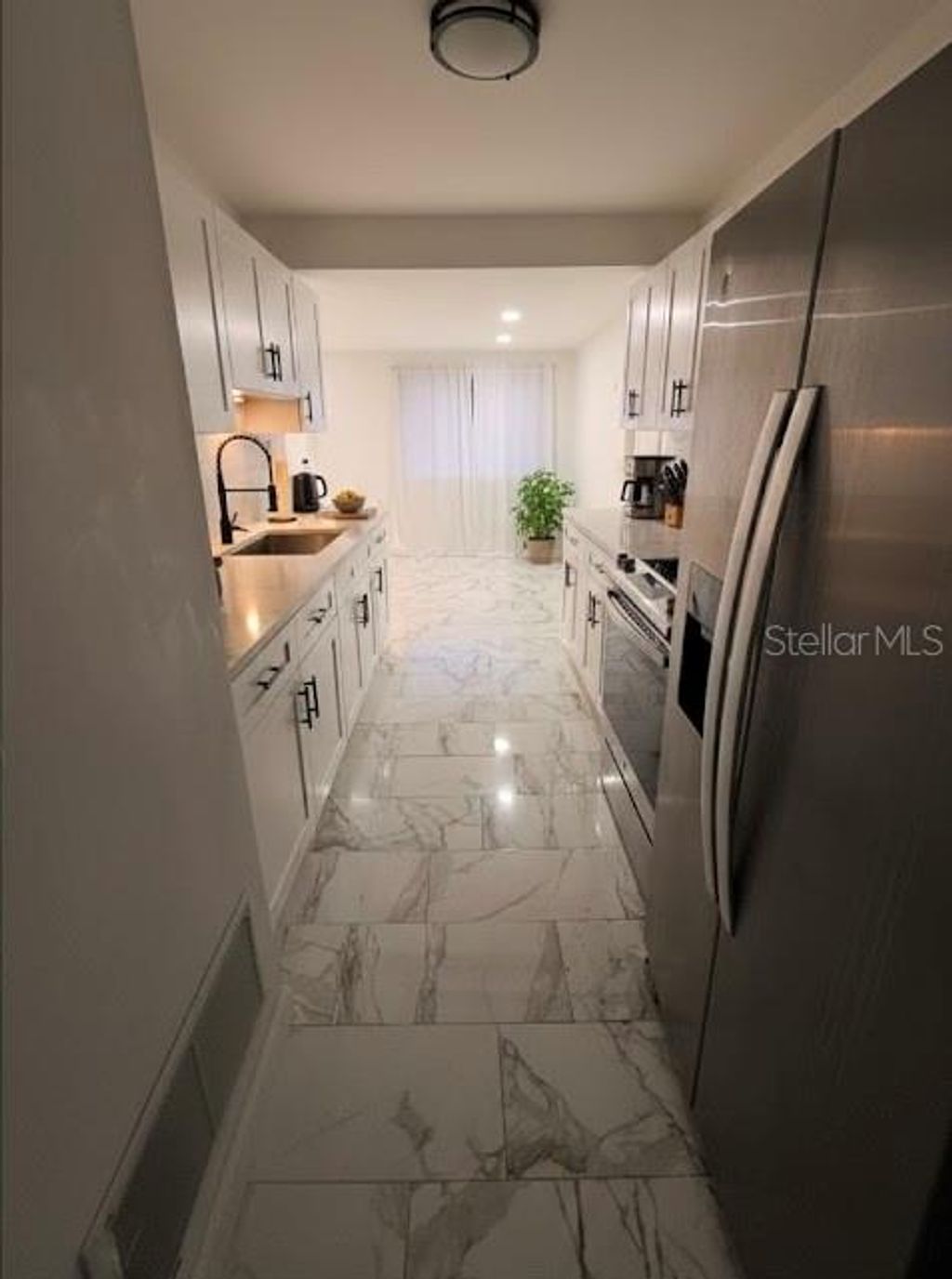 Photo of 7714 W Powhatan Ave, Tampa, FL 33615 (MLS # TB8461330)