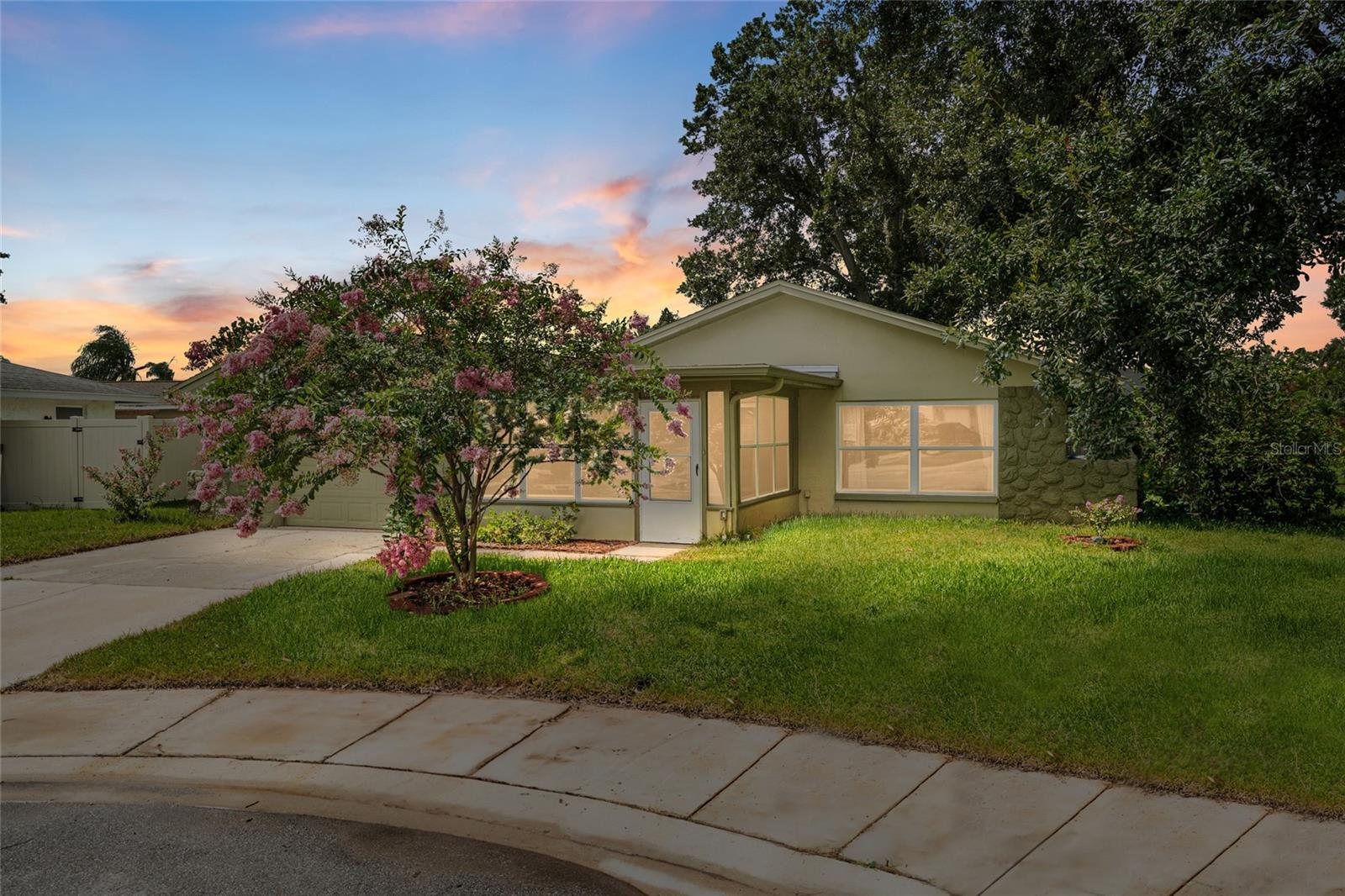 Welcome to 1811 Hibiscus Court South, a charming 4-bedroom, 2-bathroom single-family home located in the heart of Oldsmar within the established Harbor Palms community. Situated on an oversized corner lot at the end of a quiet cul-de-sac, this property offers both privacy and convenience. With 1,638 square feet of living space, this home provides a spacious and functional layout, ideal for everyday living and entertaining.
Inside, you’ll find a bright, open floor plan that seamlessly connects the living, dining, and kitchen areas. The home features both a living room and a family room, which is centered around its own wood-burning masonry fireplace, creating a warm and inviting atmosphere. The BRAND NEW 2025 kitchen is thoughtfully designed with stone countertops, tile flooring, and a practical layout that opens to the dining and family areas, making it perfect for gatherings.
The primary bedroom is located on the main floor and features a built-in dual closets (one of which is a walk-in!) and an en-suite bathroom. Additional bedrooms are also located on the main level, making the layout especially convenient for families or guests. The interior is finished with a combination of tile and carpet flooring, and the home includes a full suite of appliances, including a refrigerator, range, microwave, dishwasher, washer, and dryer.
Step outside to enjoy the peaceful surroundings and relax on the covered front porch. The large, partially fenced yard provides ample space for gardening, pets, or future outdoor enhancements. Mature landscaping, an irrigation system, and thoughtful exterior lighting add to the home’s curb appeal and functionality.
This property also includes an attached one-car garage and is equipped with underground utilities, public water and sewer connections, and access to high-speed internet and cable. Best of all, there are no HOA or CDD fees, offering greater freedom and flexibility for homeowners.
With its prime location near parks, top-rated schools, shopping, and the vibrant dining scene of downtown Oldsmar, this home is an exceptional opportunity to enjoy Florida living at its best. Whether you're looking for your first home, a family upgrade, or a solid investment property, 1811 Hibiscus Court South is ready to welcome you home.