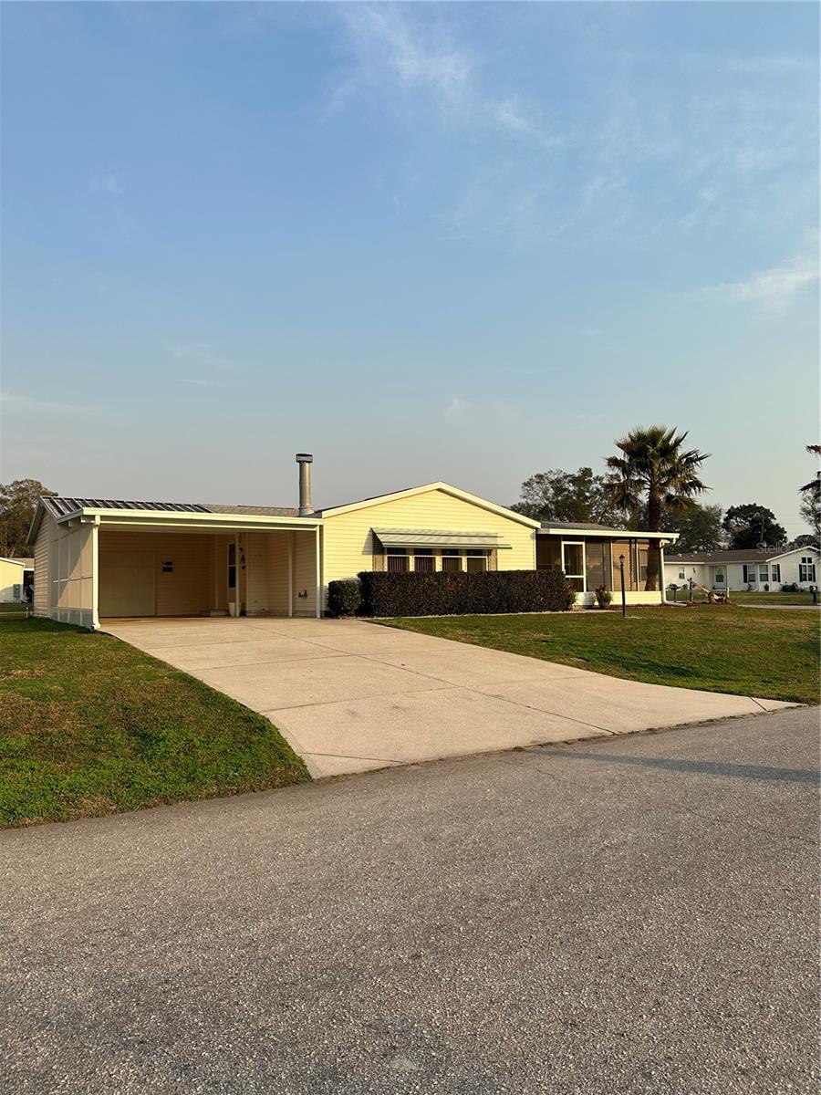 SELLER NEEDS QUICK SALE!!!! WILL CONSIDER ALL OFFERS!! Must be under contract by June 30,2023.
One of the Largest Modular Homes in 'The Falls of Ocala'. The HOME has a Newer Roof (2019) and boasts 1,920 square feet of living space with split bedroom layout, a living room/dining room combo just inside the front entry door. To your right is the master bedroom with a Large walk in closet and a master bathroom with double sinks, garden tub, walk in shower and additional linen cabinets. The family room is 24 ft. x 13 ft., has sliding doors to the large, front screened in porch (19ft. x 13 ft.), The Family room also comes with built-in shelves and a brick wood burning fireplace. The Eat-In Kitchen has an Island, solid wood cupboards, dishwasher, garbage disposal, stove, built in microwave, and a double door refrigerator (with ice maker that is not currently hooked up). To the right of the kitchen is the 2nd bathroom and 2 bedrooms. The bath has a Tub with Shower and built in linen cupboards along with the single vanity. Bedroom 2 has a walk-in closet while bedroom 3 has a double door wall closet. The inside laundry room that has it's own sink with vanity and cupboards for storing all your cleaners. The washer/dryer area is set back giving you plenty of space for moving through the laundry while going in and out the side door to the 2 car carport. The Golf Cart garage is right outside the side door and has a workshop in it as well. The Falls of Ocala is one of the hugely popular 55+ communities in Ocala and in High demand. Homes usually sell very quickly! As you come into the community you will see where it gets it's name. There is a Waterfall in the center of the roundabout. It is an HOA community and the $170 monthly fee pays for your lawn mowing, water/sewer, pool maintenance, common ground taxes and facility insurance plus the HOA Manager. Come see this one before it's gone and make an offer!!!