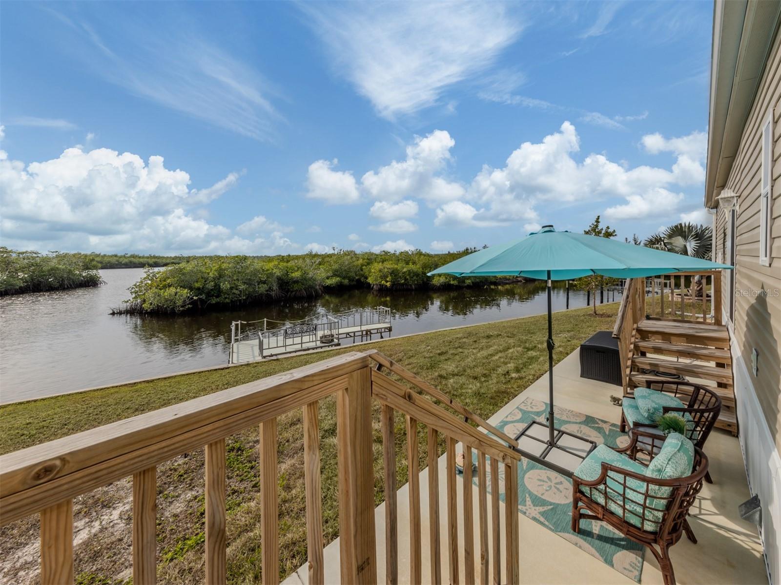 Experience waterfront living at its finest in this stunning 2023-built, 2-bedroom, 2-bath manufactured home situated along the scenic Myakka River in the highly sought-after Lazy River Village. Designed to meet the same rigorous standards as traditional wood-frame homes, this residence is built to withstand Florida’s storms while offering modern luxury and comfort.
Inside, the wide-open floor plan is perfect for both relaxation and entertaining, featuring high ceilings with elegant crown molding and an abundance of natural light. The stylish kitchen boasts solid wood cabinetry, a spacious island, and breathtaking river views through the large sliders in the open living area. The master suite is a serene retreat, offering its own stunning water view—imagine waking up each morning to the beauty of the Myakka. A second well-sized bedroom and an inside laundry room add to the home’s convenience.
Step outside to your private dock, where you can launch a kayak, store your boat, cast a fishing line, or simply take in the picturesque west-facing views, mesmerizing sunsets and abundant wildlife including dolphins, manatees and wading birds. The home also features a generous 364 sq. ft. garage with an attached carport, plus a charming riverside patio perfect for unwinding in the coastal breeze. To make this home truly move-in ready, most of the high-end coastal furnishings and décor are included in the sale.
Located in Lazy River Village, a premier 55+ waterfront community, residents enjoy a wealth of amenities, including a heated pool, spa, fitness center, pickleball and tennis courts, a marina, and a clubhouse with an active social calendar. Whether you're looking for an active lifestyle or peaceful waterfront serenity, this home offers the best of both worlds. Don't miss your chance to own this slice of paradise on the Myakka!