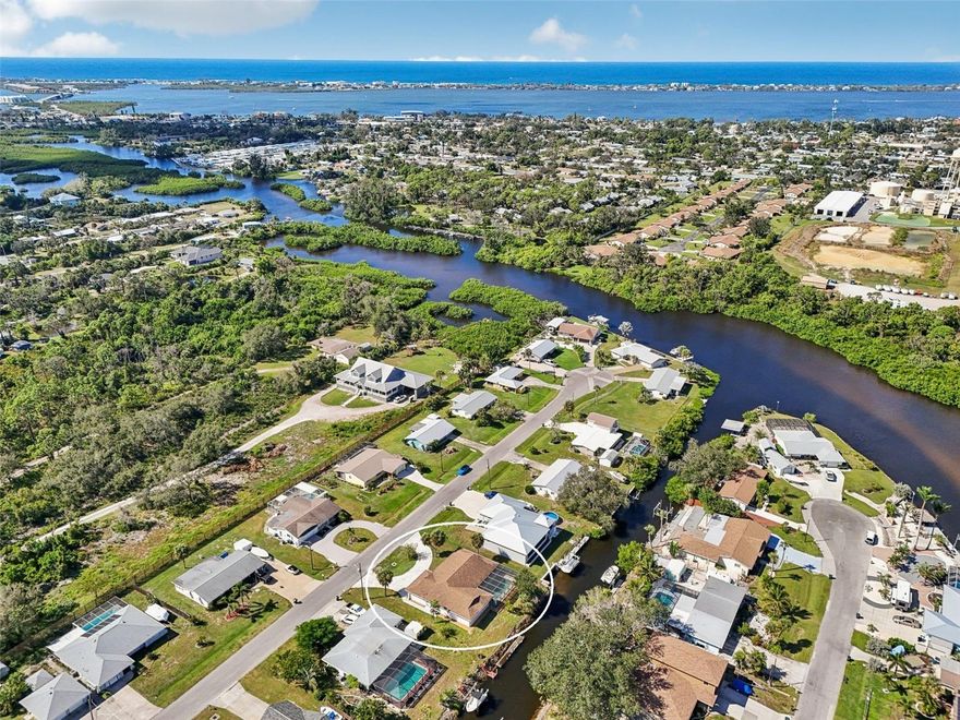 Boater’s Dream Home with Pool, Dock, and Gulf Access! This canal-front pool home on Gottfried Creek is set up for sunny Florida living. The three bedroom, two bathroom layout offers direct access to Lemon Bay and the Gulf. This home has the option to purchase a membership to the Englewood Gardens Beach Club, which offers a wide array of amenities, including access to Englewood Beach, a bayfront boardwalk and dock, bayside kayak storage and launch dock, special events, a clubhouse, picnic tables, a patio and gazebo with gas grills, Wi-Fi access, and use of the clubhouse for private events. The exterior features a hurricane rated garage door, a circular driveway, and recently installed impact double front doors with decorative glass inserts. Inside, luxury vinyl plank flooring is in the living areas while the entry and bathrooms are finished in tile plus there are plantation shutters throughout to add a luxury feel and plenty of privacy. The family room has a nice beverage center bar with wine refrigerator, wood beams on a vaulted ceiling, and sliding glass doors for pool access. The kitchen is equipped with white shaker style cabinetry, stainless steel appliances, a closet pantry, a decorative tray ceiling, a breakfast bar, and an impact rated window that looks over the pool and canal. The family room adds everyday comfort with a beverage center and wine refrigerator, wood beams on a vaulted ceiling, and sliding glass doors that step out to the screened pool area. The primary ensuite provides sliding glass doors to the outdoors, a walk-in closet, and a bathroom with a solid surface vanity and a tub and shower combination. Two additional bedrooms accommodate guests and family, and they share a bathroom with a solid surface vanity and a step-in shower. The screened pool is spacious for entertaining and perfect for floating the afternoon away. The dock did take storm damage and will need repairs, but once addressed it can again be a place to relax with a cocktail or drop a line for dinner. The home itself had no flood or hurricane damage, offering welcome peace of mind. You can enjoy everything the area has to offer with easy access to Historic Dearborn Street, Englewood Beach is only about three miles away, and there are plenty of shopping, dining, and medical services nearby, making this a complete coastal lifestyle home. Make plans today to see 560 Sandlor Drive, contact us to schedule your private showing.