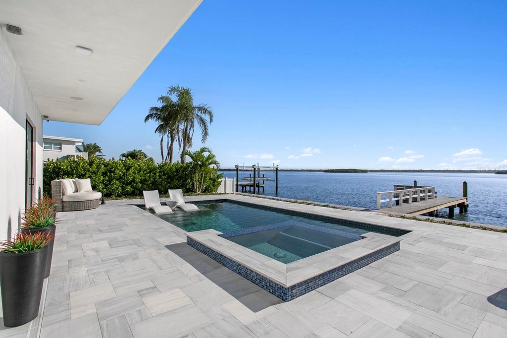 Photo of 445 129th Avenue E, Madeira Beach, FL 33708 (MLS # TB8550980)