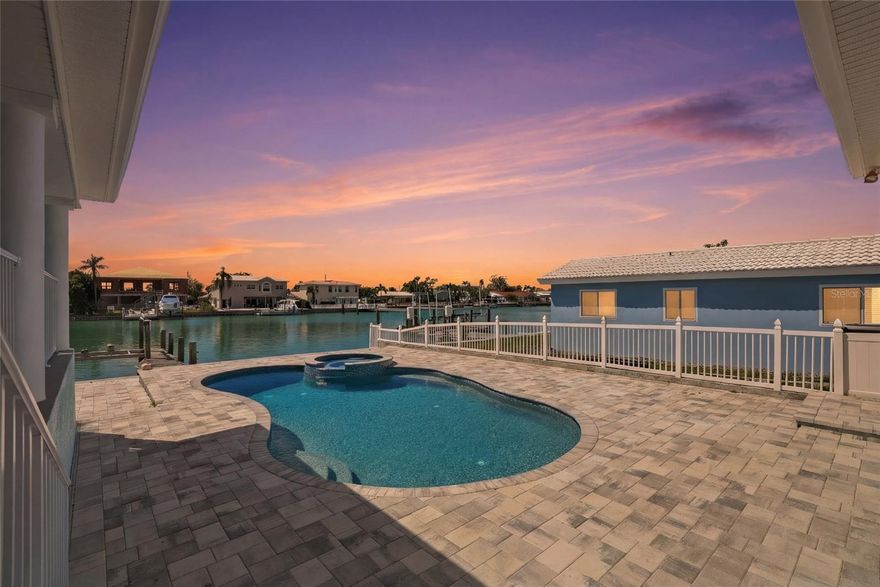 Welcome to waterfront living at its finest in the highly sought-after boating community of Treasure Island! Built in 2003 and fully remodeled again in February 2024. What makes this property special is the elevated driveway and the 9.5 feet above sea level and not flooding during Hurricane Helene or Milton. This beautifully maintained 4-bedroom, 3-bath residence offers solid construction, peace of mind, and timeless coastal elegance.  From the moment you arrive, the tropical curb appeal sets the tone. Inside, you’ll find a light-filled, open layout with spacious living areas designed for entertaining and everyday comfort. The home features high ceilings, office, butler pantry, amazing kitchen with new appliances, generous bedrooms, well-appointed baths, and beautiful interior finishes that perfectly complement the coastal lifestyle. You will see all the added extra touches that make this home truly one of a kind.  Step outside to your private backyard oasis featuring a sparkling pool and spa overlooking the water. Boaters will love the private dock with quick access to the Intracoastal and Gulf — ideal for fishing, sunset cruises, paddleboarding, or heading out for waterfront dining by boat. This is truly a boater’s dream location in an established waterfront neighborhood. Whether you are hosting family and friends or relaxing by your pool this backyard and home is ready to accommodate. Treasure Island is one of Florida’s most beloved beach communities, known for its wide sandy beaches, vibrant sunsets, waterfront restaurants, charming local shops, and relaxed yet lively coastal atmosphere. Whether you’re biking along the beach paths, enjoying live music, or watching dolphins from your dock, life here feels like a permanent vacation.  Live where others vacation — in a city that blends laid-back beach living with an active boating lifestyle.  This is more than a home… it’s the ultimate Florida waterfront experience.