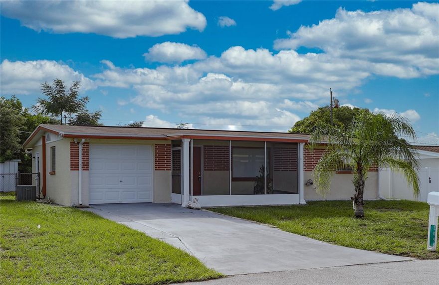 Welcome to 2048 Melody Dr, a charming 2-bedroom, 1-bathroom home with 956 sq. ft. of well-designed living space in the heart of Holiday, FL. Nestled in Pasco County's desirable Ridgewood Gardens, this property offers a rare combination of affordability and convenience with NO HOA restrictions. Major peace of mind comes from the newer roof installed in 2017, saving you thousands in future maintenance. The home includes a true 1-car garage, inside utility hookups, and central HVAC. Enjoy an open-concept living and dining area filled with natural light, two generously sized bedrooms, and a functional kitchen ready for your personal touch. The oversized 5,246 sq. ft. lot provides ample space for gardening, pets, or even adding a future pool. Location is everything—you're just minutes from the world-famous Tarpon Springs Sponge Docks, Fred Howard Park, Anclote River Gulf access, and stunning Gulf beaches. Quick access to US-19 means easy commuting, shopping, dining, and medical facilities are all nearby, with Tampa International Airport only about 45 minutes away. Whether you're a first-time homebuyer, downsizer, or investor, this solid 1963 block home offers incredible value in a prime location. Schedule your showing today before this Melody Dr gem is gone!