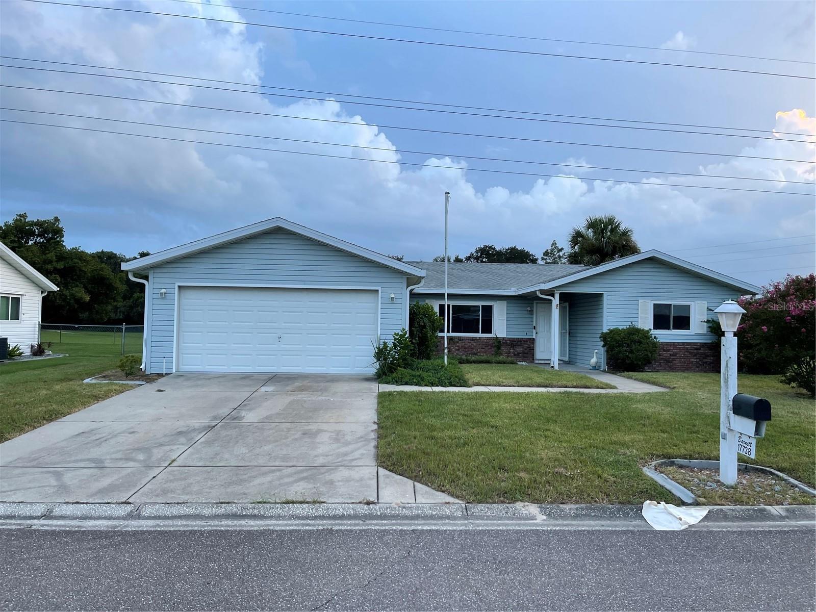 Super duper deal in this lovely community. Enjoy being next door The Villages with at a much lower price. Right now, this is the best deal for money. HVAC 2017 and roof 2019 with upgraded windows in 2018. Freshly painted with a new flooring allowance. Spacious Florida room/lanai and three bedrooms 2 baths. Backs up to walking and biking trails so no neighbors directly behind.