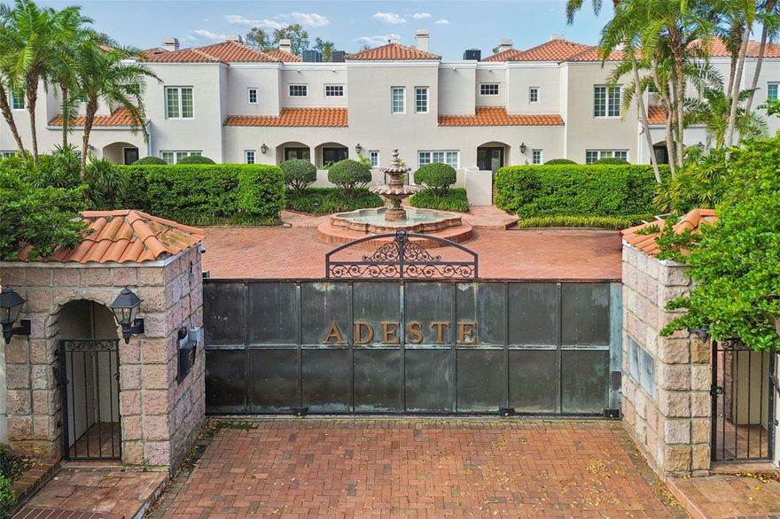 Calling all art collectors to view this fully renovated 3/3 townhouse-style condominium with 9- and 12-foot ceilings on the first floor and heavy crown mouldings to provide the perfect canvas to showcase your collection. Three sets of double-paned French doors with large transoms open from the breakfast and family rooms into a walled courtyard bringing abundant natural light and offering open access to a professionally landscaped and lighted private oasis for relaxing or entertaining. The two-story screen enclosure allows bug-free enjoyment and creates additional living space. Features include recently replaced double mahogany front doors with leaded glass; wide plank wood floors, a double-sided wood-burning fireplace; white wood cabinets, granite countertops, tiled backsplash, stainless steel appliances, and a walk-in pantry; mirrored wet bar; six skylights to allow generous natural light into the interior; custom created steel railings and banister; soaking tub, separate shower, and double sinks; large walk-in closets; French doors from the primary bedroom to a balcony overlooking the courtyard; and Speed Queen commercial washer and dryer. The floor plan is ideal for modern living with the wall removed between the kitchen and living room providing a very open feel. The first floor bedroom and full bath is currently used as an office but offers peace of mind by providing ground-floor accommodations. (The closet has been converted to built-in shelving but could be returned to closet space.) The secondary and primary bedrooms on the second floor each have a connecting bath and are separated by a  13' x 22' family room, offering additional living space and creating a split bedroom plan. 4951's location at the back of Adeste is a bonus, offering access from Pilgrim's Pathway to your two car garage. Your guests can arrive via the gated entrance with a Bayshore address to a lushly landscaped motor court anchored by a European style fountain. West Coast Management oversees the 17 unit, gated community which offers easy lock and leave living. There has been NO FLOODING in unit 4951 or the garage. The Ballast Point location across the street from townhomes fronting the Hillsborough Bay is ideal for enjoyment of Bayshore Boulevard's linear park and Ballast Point Park's interactive water feature and pier, two blocks south. Adeste's location offers an easy commute to Downtown Tampa in 5.8 miles, MacDill Air Force Base Bayshore gate in 2 miles, Tampa International Airport in  7.5 miles, and to the Pinellas beaches fronting the Gulf of America in 23 miles. Local restaurants and well-maintained parks are within walking distance. Call today to see this special home. All information is believed to be accurate but should be confirmed by Buyer. The $1,850 monthly condo fee includes insurance on the property, wind, and full limits of flood, as well as water, sewer, solid waste disposal, internet, basic cable, exterior and roof maintenance, including paint, and yard maintenance in both the courtyard and exterior grounds. Adeste offers well managed, lock and leave living. Call today for your tour!