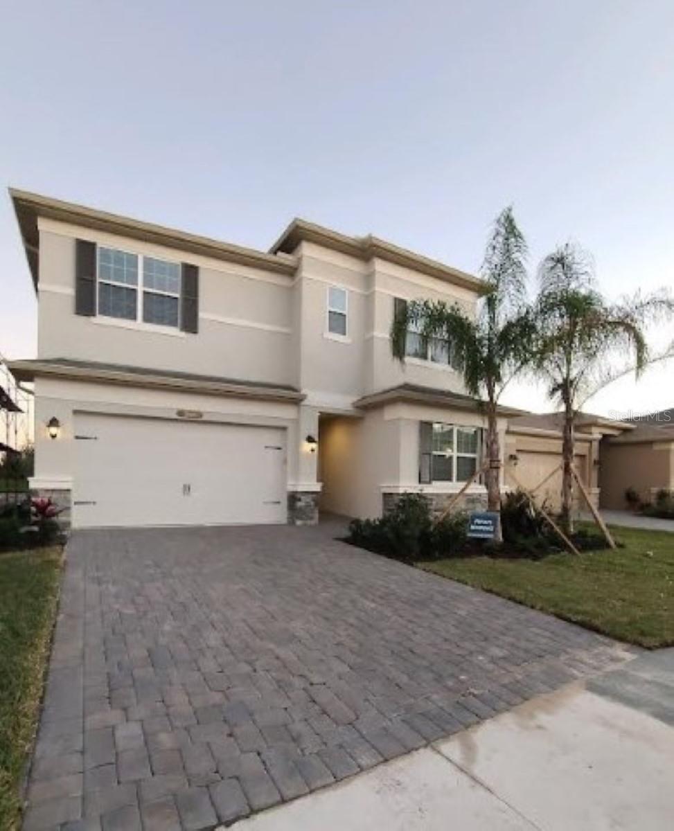 You will love this house!! Four full bedrooms and three full baths. Full bed and bath on the first floor too. This home is in the newer, gated community of Winding Ridge in Wesley Chapel. Beautifully constructed and super clean. Paved driveway and lush landscaping that the HOA maintains. This home boasts a large open kitchen/great room. Custom cabinets, stainless appliances, Quartz counters, and marvelous backsplash. Downstairs is fully tiled with new carpet upstairs. All baths have granite counters. The master suite boasts dual walk-in in closets, dual vanities, separate soaking tub, separate shower, and private water closet. Huge laundry room upstairs with new washer and dryer. New ceiling fans in all bedrooms. Lawn service and trash included. Two medium sized pets are welcome! Call today for your showing of this Grand Home.