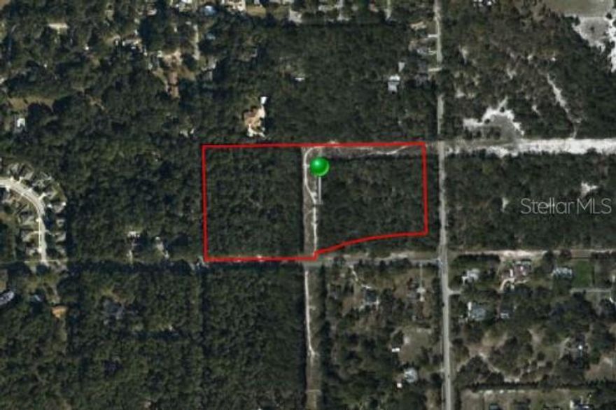 16.41 Acre Corner Lot with Favorable Residential Zoning for Development.