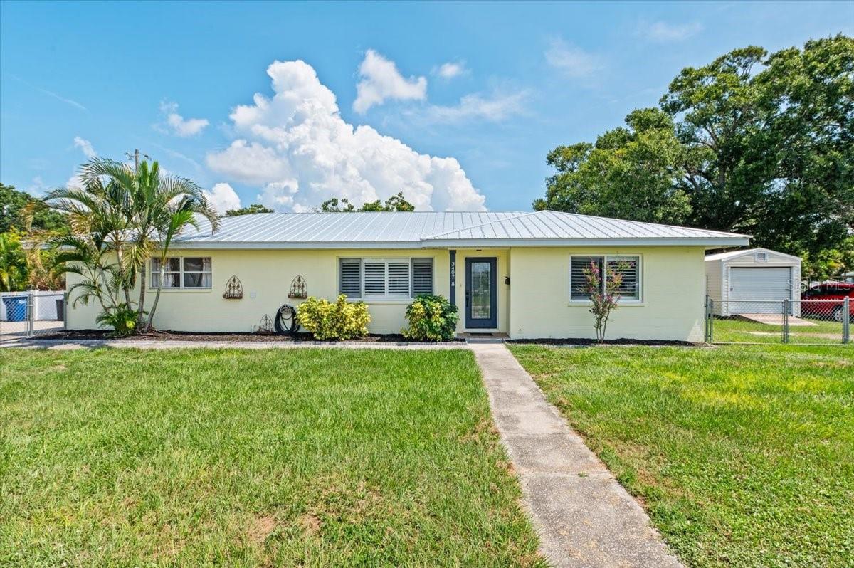 Discover the rare blend of size, flexibility, and location in this spacious 5-bedroom, 2-bath home, perfectly positioned on a double corner lot in the heart of West Bradenton. Whether you're seeking extra bedrooms for a growing household or looking to maximize income potential through short-term rentals, this home delivers.
New metal roof (2023) adds peace of mind and long-term value. Inside, the layout offers exceptional versatility. One of the bedrooms includes a private exterior entrance—ideal for a guest suite, home office, or separate rental space. Three bedrooms feature mini-split A/C units, enhancing energy efficiency and providing customized comfort for every occupant.
A spacious additional family room offers endless potential—use it as a formal dining area, game room, or media lounge. You're just minutes from the Gulf beaches, hospitals, local shopping, and one block away from Manatee High School, making this an unbeatable location for both lifestyle and convenience.