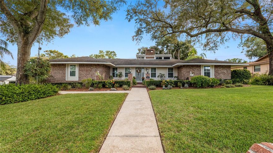 Welcome to this stunning South Lakeland pool home located in one of the area’s most sought-after and established neighborhoods. This beautifully maintained 4-bedroom, 3-bath residence with a large bonus room offers over 3,100 square feet of living space, perfectly blending comfort, functionality, and timeless appeal.

Step inside to find soaring vaulted ceilings, a wood-burning fireplace, and an inviting floor plan that includes both a formal living room and a formal dining room—ideal for gatherings and entertaining. The updated kitchen features stainless steel appliances, granite countertops, a cooking island, and a bright breakfast nook, along with an oversized laundry room that offers extra pantry and countertop space.

The spacious primary suite includes an updated en suite bath with double vanities, a huge walk-in shower, and direct access to the lanai and pool area. Three bedrooms, including the master, are located on one side of the home, while the fourth bedroom, full bath, and versatile bonus room are on the opposite side—perfect for guests, a home office, or even a fifth bedroom.

Throughout the home, you’ll love the new luxury vinyl plank flooring installed during the 2020 remodel, along with beautifully updated bathrooms that reflect a fresh, modern style. The brick exterior gives this property exceptional curb appeal, and French doors open to a covered lanai overlooking the sparkling saltwater pool, which was resurfaced in 2019. The pool area features gorgeous Riverstone decking, a screen enclosure completed in 2023, and a bar area ideal for an outdoor kitchen or entertaining space.
The fully fenced backyard is both attractive and functional, with a mix of white PVC fencing and a brick wall, plus an additional parking pad behind double gates—perfect for extra vehicles, a boat, or recreational toys. The lush landscaping, mature oak trees, and inviting courtyard entry create a warm and welcoming first impression.
Major system updates include a new roof (2017), new windows (2018), and AC replaced in 2019, giving buyers peace of mind for years to come.

This home truly has it all—space, style, thoughtful updates, and a prime South Lakeland location close to excellent schools, shopping, and dining.