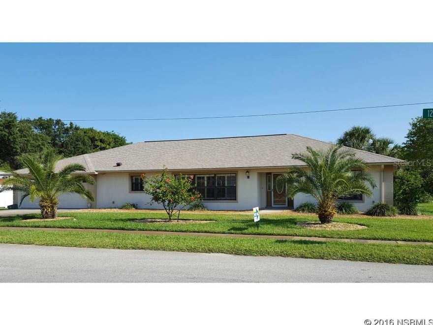 NEW ROOF AND PRICE DROP! SPACIOUS, IMPRESSIVE 4 CAR GARAGE CUSTOM home in Florida Shores!. An ideal lakefront home setting on a well-manicured palm tree double lot with room for a pool.  SO MANY outstanding features! As you enter the open floor plan with vaulted ceilings there are two seating areas, a very large custom kitchen and dining area.  Double french doors lead to the Florida room with an added covered patio overlooking the unspoiled lake setting.  This home has plantation shutters, hurricane shutters, a well irrigation system, high-end lighting, solid wood doors, custom cabinetry, stainless steel appliances, corian counter tops, over and under cabinet lighting, a separate tiled mud room with laundry, split master bedroom with vaulted ceiling, large walk-in closet and a roomy tiled shower with seat.  Enjoy water views from every room in the home! ;Water: City