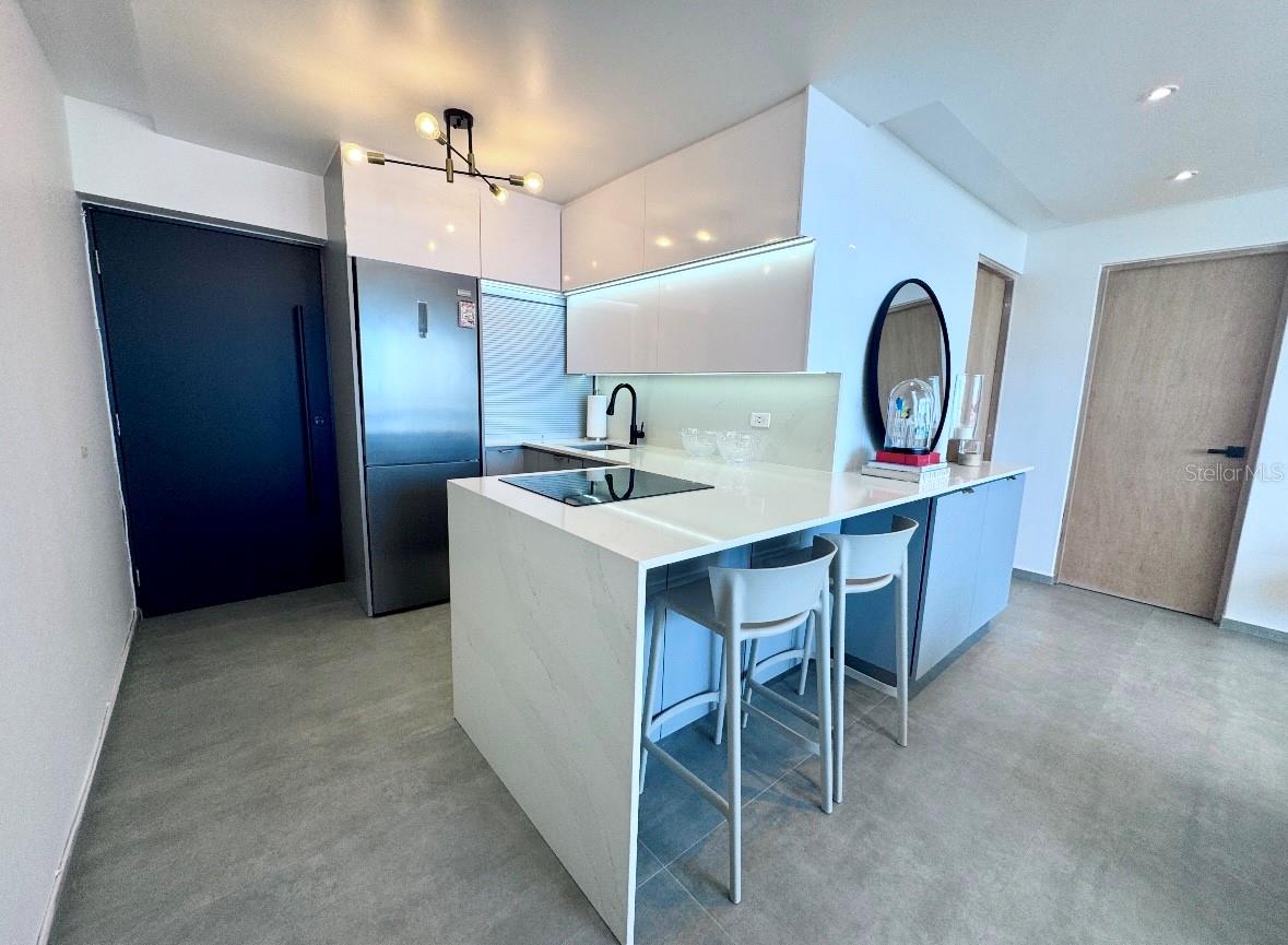 ADALIGIA CONDOMINIUM • Offers the perfect blend of comfort and convenience in the sought-after Condado neighborhood. This elegantly remodeled 700 sqft, 1 bedroom and 1 bathroom unit comes fully furnished, for immediate move-in. The kitchen is well-equipped with refrigerator and stove top. A convenient washer/dryer combo, full power generator and a dedicated parking space, adds to the ease of living.
Adaligia Condominium is a commercial and residential complex with 30 commercial spaces and 28 apartment units right in front of the Presbyterian Hospital. It has a full capacity generator, water cistern, security and 1 covered parking space. Superb location close distance to top restaurants, hospitals, entertainment options, shopping venues and some of the best schools.
