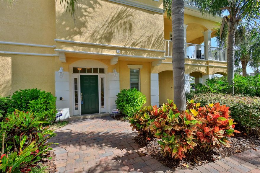 Stunning 3 bedroom 3 bath fully furnished Mediterranean townhome with 2 car garage and tile roof 1 block to the beach. Allows weekly rentals. Ceramic tile in living room, dining room, kitchen, foyer, laundry and bathroom. Master suite downstairs with huge walk in closet, master bath with dual vanities, separate jetted tub and separate shower. Fireplace in living room, surround sound speakers and sliding glass doors leading to the covered balcony. Upstairs French doors lead to 2 guest bedrooms with separate bathrooms. 
Open kitchen with granite counters , stone backsplash, wood cabinets and breakfast bar. Crown molding and 8 foot doors throughout. Security System, intercom with front entry speakers, outdoor shower with close access to community pool. ;Water: City