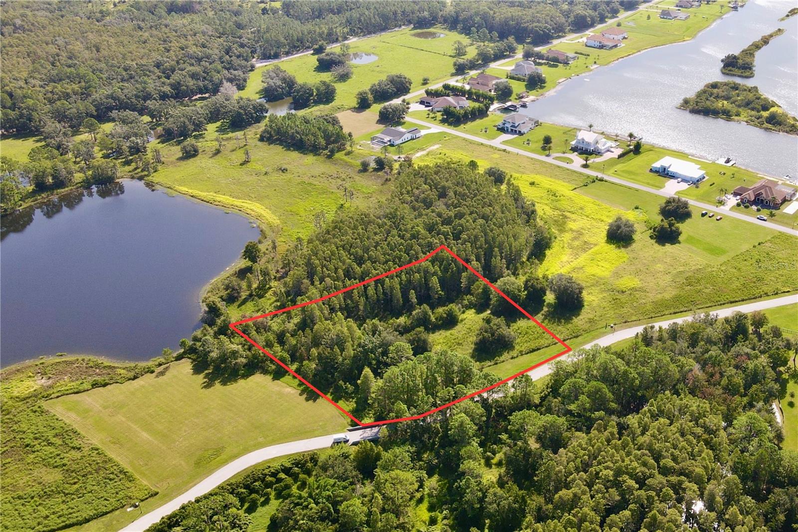 Outlaw Ridge offers seven spacious residential lots ranging from 1 to 1.88 acres, nestled within a private, gated community designed for custom-built homes. Located in a quiet and scenic setting, the community offers a peaceful atmosphere surrounded by nature
and is ideal for those seeking a quiet lifestyle.
The available lots include a mix of wetlands and floodplain areas. Many of the sites back up to wooded areas or designated conservation land, offering serene views and privacy. Utilities are well and septic.
The lots are located within Outlaw Ridge, a gated community, on Outlaw Way and Hideout Trail in Land O' Lakes in Pasco County. Outlaw Ridge is situated on Ehren Cutoff. Ehren Cutoff connects US 41 to State Road 52.
The site is approximately 10 minutes from US Highway 41, where nearby medical shopping, and schools are located. Additionally, it's 1.6 miles from State Road 52, 5.9 miles from I-75, and 7.6 miles from the Suncoast Parkway. The area offers a mix of rural and urban surroundings. Due to its proximity to major thoroughfares, it's just a short commute from Wesley Chapel (20 minutes), Dade City (25 minutes), Brooksville (30 minutes), New Port Richey (40 minutes), Tampa International Airport (40 minutes), downtown Tampa (40 minutes), and downtown St. Petersburg (50 minutes).