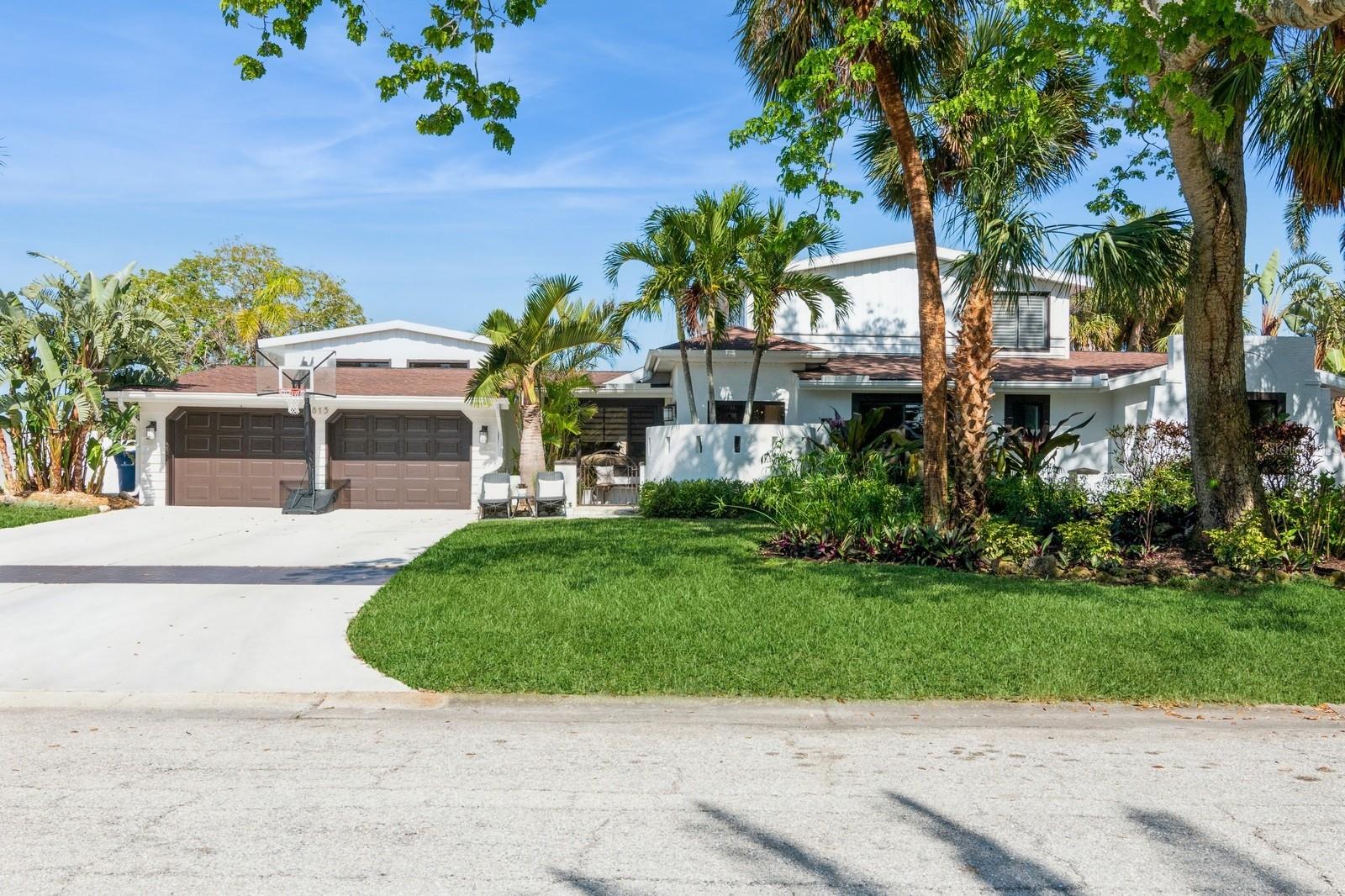 Luxury Waterfront Home on Siesta Key - Boater's and Entertainer's Paradise! Welcome to your dream waterfront retreat on Siesta Key! This stunning 4 bedroom, 3.5-bathroom home plus bonus room comes FULLY turnkey furnished ready to live in or make it an income earning vacation rental (monthly rentals allowed -some wall art is not included). There are 3 bedrooms on the main floor each with walk-in closets and the second floor is exclusively the primary suite with large walk-in closet and spa-like bathroom with an air-jetted tub. Bring your toothbrush and enjoy a home that is ready to move in, perfectly situated towards the end of a cul-de-sac street and faces a canal which leads to Sarasota Bay. Featuring a private dock with a boat lift, heated swimming pool with spa and don't forget the tropical waterslide! Duchateau flooring throughout main living areas, quartz countertops in kitchen, and travertine flooring in bathrooms. Enjoy entertaining in the extra-large party room/second living area which features a built-in bar, pool table, hideaway pocket sliders with disappearing wall that leads right to outdoor dining area/pool. There is also a bonus room that is currently being used as a home gym. The backyard is fully fenced for pets and the home did not have any water intrusion during hurricanes and sits at 8 ft elevation per the elevation certificate.