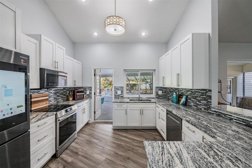 Photo of 3223 Harvest Moon Drive, Palm Harbor, FL 34683 (MLS # TB8491064)