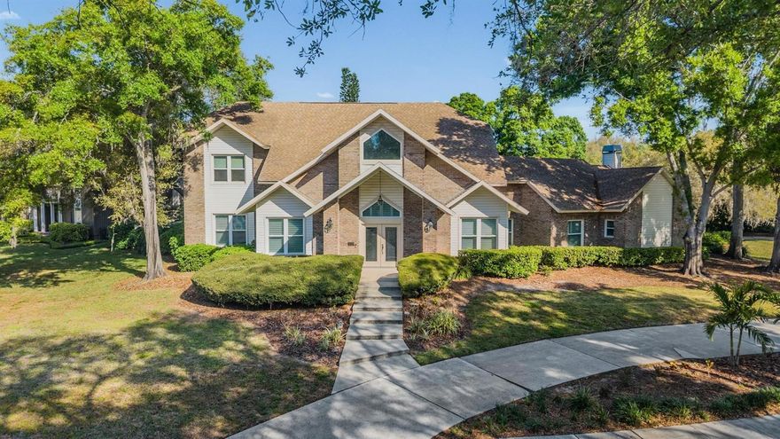 Welcome to this beautifully updated 5 bedroom 3 ½ bath Pool home in the desirable Autumn Woods neighborhood of Palm Harbor with its rolling hills and low HOA fees. This home features just under 4,100 s.f. with several bonus rooms and a media/game room and is perfect for entertaining family and friends. Enter the home to a light and bright foyer with a view through the media/game room to the pool and lanai area. The large dining room is to the right with first floor bedrooms, a full bath (also serves the pool) and a bonus room to the left. There is a coffee bar/serving area near the dining room with the kitchen, dinette and family room next to and to the right of the dining room. The kitchen features granite counters, shaker style cabinets, an induction cooktop range with air fryer capabilities and a WiFi refrigerator. The family room has a wood burning fireplace and features vaulted ceilings with an impact slider out to the pool and lanai area. The laundry room and a ½ bath are off of the family room. One of the first floor bedrooms has an adjacent bonus room and access to the full bath and could serve as a multi-generational space. Another first floor bedroom features French doors and could be used as a home office. The media room/game room includes a dry bar with a wine refrigerator, 2 large TV’s that will convey and a newer impact double slider with access to the pool and lanai. Upstairs you will find 2 bedrooms and a full bath behind a barn door added to give additional privacy to the bedrooms along with the primary suite. The generously sized primary suite has 2 walk-in closets and a large bath with 2 separate vanity areas: one with the shower and one with the toilet along with a garden tub and towel heater rack. Your outdoor oasis includes a fully screened oversized lanai complete with a Charbroil gas grill, prep sink and prep area along with a pool and jacuzzi (resurfaced in 2019). Additional outdoor space includes a brick pavered patio covered by sail cloth and a firepit area. The backyard is fenced with vinyl fencing (added in 2020) giving you privacy. Off of the lanai is another bonus room currently being used as a home office that could serve as a game room for the pool area. Updates include: Impact windows and sliders 2020; pool resurfaced 2019; Roof, HVAC and water heaters 2018; vinyl fencing 2020; plantation shutters 2024. HOA amenities include tennis/pickleball courts, a basketball court, a dog park, and a playground. The low HOA fees include trash pickup. Autumns Woods is zoned for top-rated schools including Palm Harbor University High School and is close to charming downtown Palm Harbor, Dunedin, Tarpon Springs, the Pinellas Trail and the Gulf beaches with convenience to Tampa and Tampa International Airport. Come see this home and make it yours today!