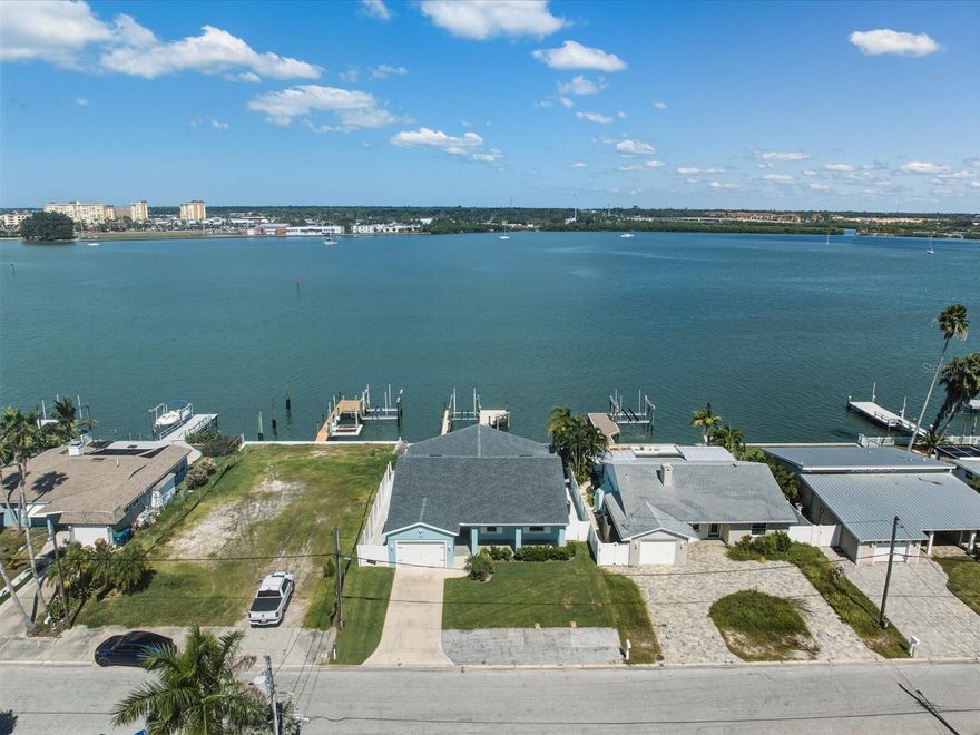 Welcome to your dream waterfront retreat! This stunningly remodeled home offers an unparalleled lifestyle with breathtaking panoramic Intracoastal views from every room and is perfectly situated just a short boat ride away from the famous Johns Pass. With your own private dock and 13K lb boat lift, this residence is a true boater's paradise! As you step into the gorgeous foyer, you are greeted by exquisite tiled floors, elegant crown molding, and a sparkling chandelier that sets the tone for the luxury that awaits. The open layout invites you to gaze directly at the mesmerizing waterfront views, creating an immediate sense of tranquility.The amazing family room features soaring ceilings adorned with wood beam accents, enhancing the spaciousness and charm of the home. Triple sliders seamlessly connect the indoor space to the oversized wrap-around tiled lanai, perfect for entertaining or simply enjoying the serene surroundings. Step outside to your NEW dock and experience the ultimate in waterfront living.
Prepare to be inspired in the chef’s gourmet kitchen, which boasts an immense granite center island complete with a stainless steel farmhouse sink, drop-down lighting, and ample bar stool space for casual dining. High-end appliances, including a wine refrigerator, a 5-burner gas range with a stainless-steel hood vent, and a built-in oven/microwave duo, make this kitchen a culinary delight. The subway-style backsplash, pearl nickel fixtures, and high-end cabinetry with a showcase window add the perfect finishing touches.The formal dining room exudes elegance with its tile floors, chandelier lighting, and wood beam ceilings. A cozy sitting area features two picturesque encased windows and crown molding, creating a perfect spot for relaxation or intimate gatherings. Enjoy showcasing your favorite art pieces on the fabulous art wall area, complete with accent lighting. Retreat to the master bedroom, where crown molding, quad closets, and a ceiling fan create a serene atmosphere. The master bath has been beautifully remodeled, featuring a tiled shower with pebble flooring, a rainmaker shower head, listello accents, and a new vanity with granite countertops, providing a spa-like experience at home.This home offers spacious guest rooms, each with tiled floors, ensuring comfort for family and friends. One guest room features a convenient walk-in closet, providing ample storage. Two other full guest baths are beautiful and adorned with custom tiles, new vanities and granite countertops.
This exquisite home is TURNKEY, allowing you to move in and start enjoying the waterfront lifestyle immediately.