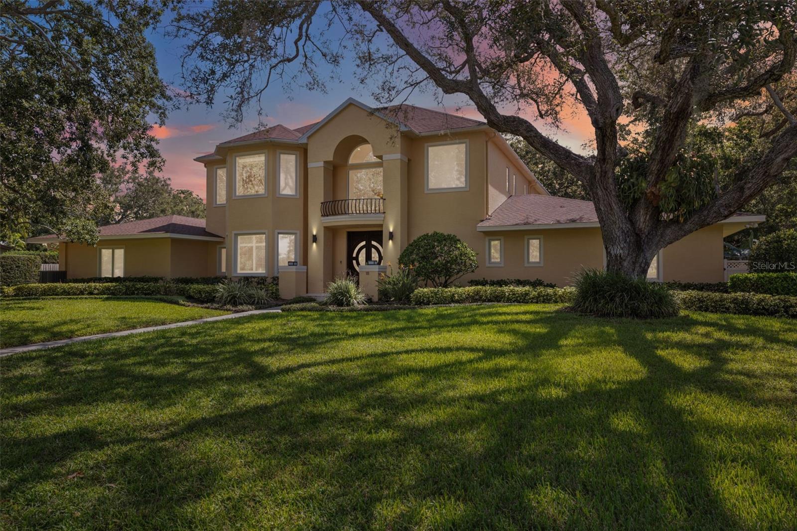Seldom does a property of this stature become available. This property has it all. Truly fantastic tree-lined, golf cart community location in the heart of Belleair Estates and steps from the Intracoastal Waterway and only minutes from Sand Key and Belleair Beach, as well as a short walk to Pelican Golf Club (host of annual LPGA) and minutes to the Belleair Country Club. Beautifully manicured oversized lot, 5-bed/4.5-bath home with extensive premium upgrades and a feature list much too long to fully list here. Huge curb appeal with two majestic mature oaks and an expansive lawn with side driveway and paved walkway leading to the stately two-story home. Grand entrance with high vaulted ceilings and large windows for ample natural light. High-end chef’s kitchen with large island, granite counters, custom cabinetry, double ovens, ice maker, reverse-osmosis water filter, and ample storage with pull-out shelving and pantry. Three full en-suite bedrooms on the first floor, each with its own private bath and walk-in-closet, plus an additional half bath off of the spacious entrance and living room area with beautiful wood floors and grand wood-burning fireplace. On the second floor, you have two bedrooms including the deluxe master bedroom suite with its own separate wood-burning fireplace, two sizable walk-in closets, large upgraded and bright private bathroom, and private balcony overlooking the spacious and beautiful fully-fenced back yard with sparking pool and spa. In addition to the 5 bedrooms, there is a bonus room on the first floor which is perfect for an office, game room, TV room, etc. All of this barely touches the surface of the high-end upgrades and bonuses, e.g. whole home + back yard integrated Sonos sound system, nearly 2,000 sq. feet of covered patio area by the pool and outdoor fireplace, built-in cabinetry in the oversized two-car garage, hurricane-rated windows, and an elevator! This home is an absolute dream for those with a large family and those who love to entertain in style and comfort. You must experience for yourself the comfortable elegance, beauty and tranquility of this location and estate.