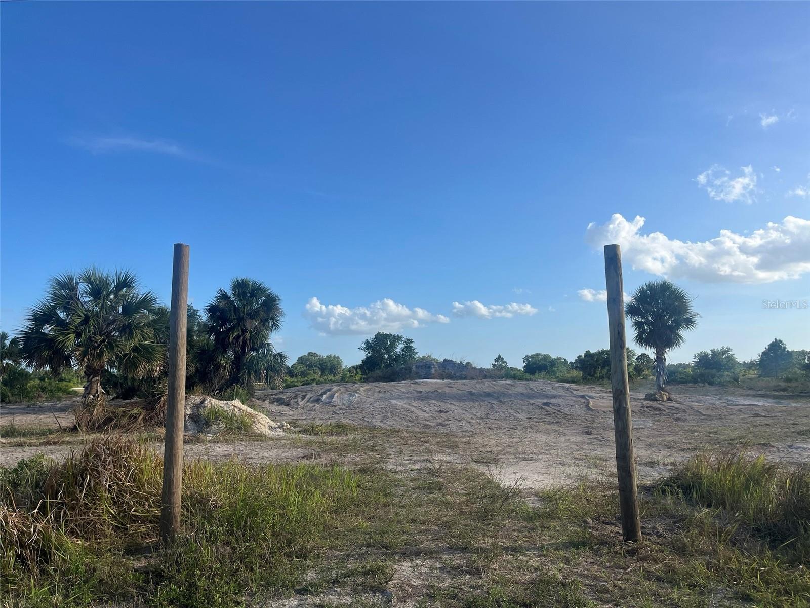 Build or bring Your Dream Home! Bring your vision to life on this spacious 1.25-acre cleared lot, already prepared for construction with a house pad, retention pond, and culvert in place. The seller has invested over $18,000 in fill, and a current survey is available, saving you time and money. Conveniently located not far off the paved road, the property offers the perfect balance of accessibility and privacy. Enjoy the tranquility of a rural lifestyle while still being close to essential amenities. Outdoor enthusiasts will appreciate nearby attractions such as Kissimmee River Preserve State Park and Lake Okeechobee, renowned for its world-class fishing. Whether your passion is fishing, hunting, agriculture, or simply enjoying wide-open space, this property provides the ideal setting to create your private retreat.