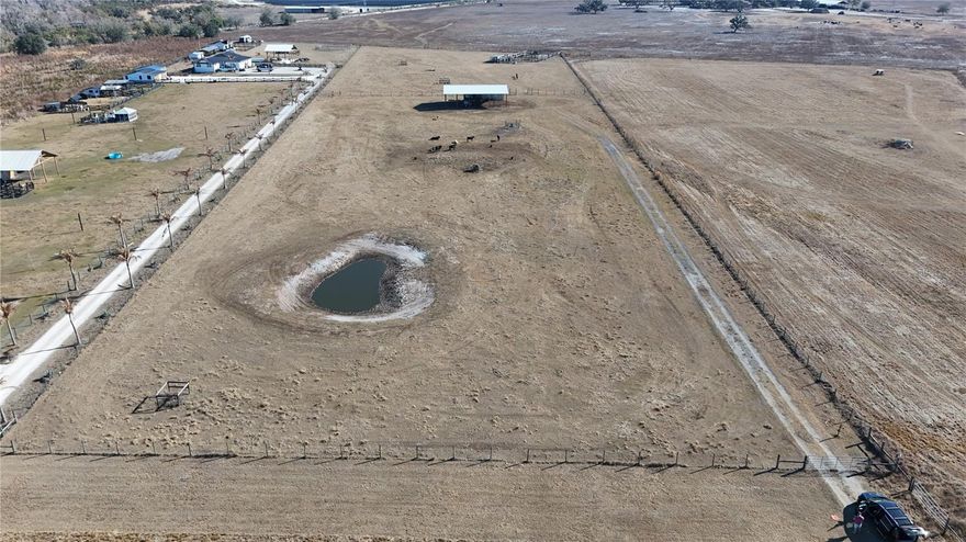 Cattle Ready 7 Acre Farm with Wells, Barn, and Pond

Beautiful and functional 7 acre cattle ready property, fully fenced with durable barbed wire and cross fenced for efficient livestock management. Designed with practicality in mind, the property features a dedicated staging paddock and a working loading chute, making cattle handling simple and efficient.

Water resources are excellent with two wells on site, including a shallow sand well and a 375 foot deep well, providing reliable water supply for livestock and land use.

The property includes a spacious 40 by 60 foot pole barn offering ample room for equipment, hay storage, or agricultural operations. A small pond adds both utility and charm, providing an additional water source and enhancing the natural beauty of the land.

Ideal for cattle, hobby farming, or a private agricultural homestead, this well equipped property is ready to go from day one.