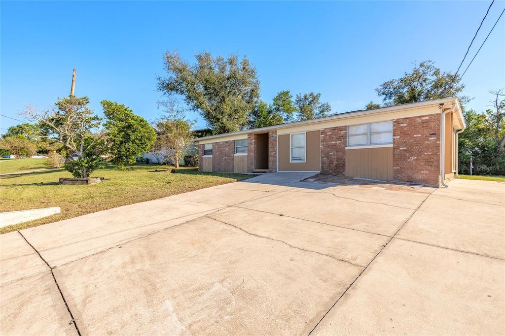 Photo of 228 E Holly Drive, Orange City, FL 32763 (MLS # V4951978)