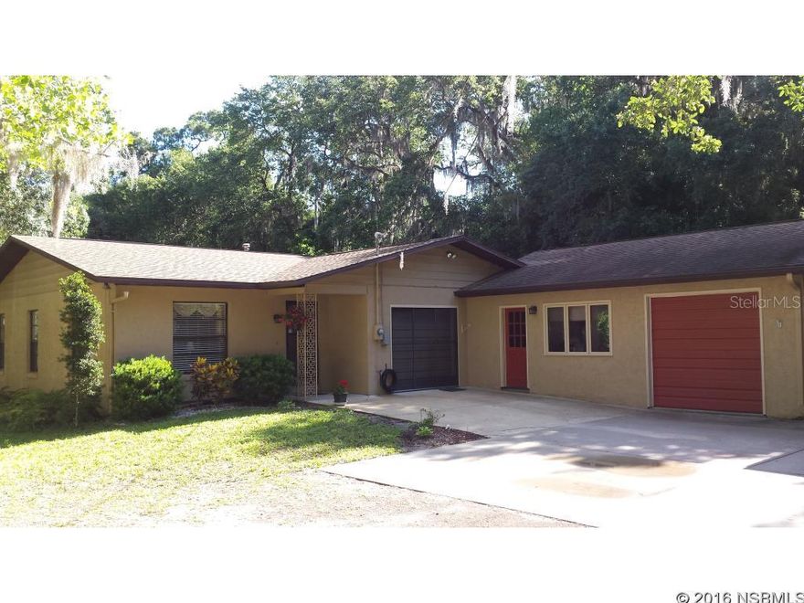 Don't miss the opportunity to own this 3 bedroom 2 bath split floor plan home  on 1.25 acres. The serene setting is the perfect place to entertain friends and family. There's plenty of storage for all your toys and hobbies. It boasts a 700 sq.ft. garage complete with workbench and air compressor which is piped outside under the carport. The 190 sq. ft. shed in the backyard has 50 amp service and the carport which could easily accommodate an RV or other large vehicle is equipped with 30 amp. Country feel with convenient location. Minutes to shopping, I 95, several golf courses and beach. No HOA. A/C installed in 2011 and warrantied until 2021. New roof in 2013. Recently installed gutters and carpet in master bedroom. Seller will consider all serious offers. Remarks: Garage is a 2 car but has only one door. ;Water: City