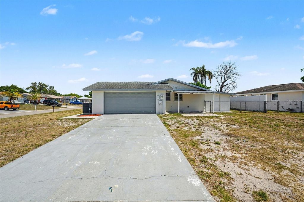 Photo of 7836 Lotus Drive, Port Richey, FL 34668 (MLS # O6400592)