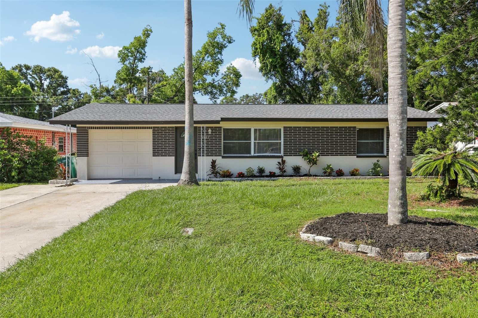 Welcome to this fully remodeled Clearwater home where modern finishes meet everyday functionality. This 3-bedroom, 2-bath residence has been completely updated with a brand-new HVAC system (March 2025), full interior remodel (May 2025), and a newer shingle roof (February 2022). Inside, you’ll find a clean, contemporary design anchored by wide-plank luxury vinyl flooring and a bright, open layout that flows seamlessly from room to room. The kitchen has been fully updated with quartz countertops, a matching backsplash, shaker-style cabinetry, and a full suite of stainless steel appliances. Both bathrooms feature floor-to-ceiling tiled walls, sleek vanities, and spa-inspired waterfall rain-head and handheld fixtures. An air-conditioned laundry room with washer and dryer hookups adds everyday convenience, while the expansive fenced backyard offers plenty of space to entertain, unwind, or add a pool. Located in a high-and-dry, non-flood zone with no HOA. This turnkey home is just minutes from BayCare Ballpark (Spring Training home of the Phillies), Northeast Coachman Park, The Long Center, and a wide range of shopping, dining, and entertainment options. Don’t miss this opportunity to own a move-in ready gem in an excellent location, schedule your private showing today!