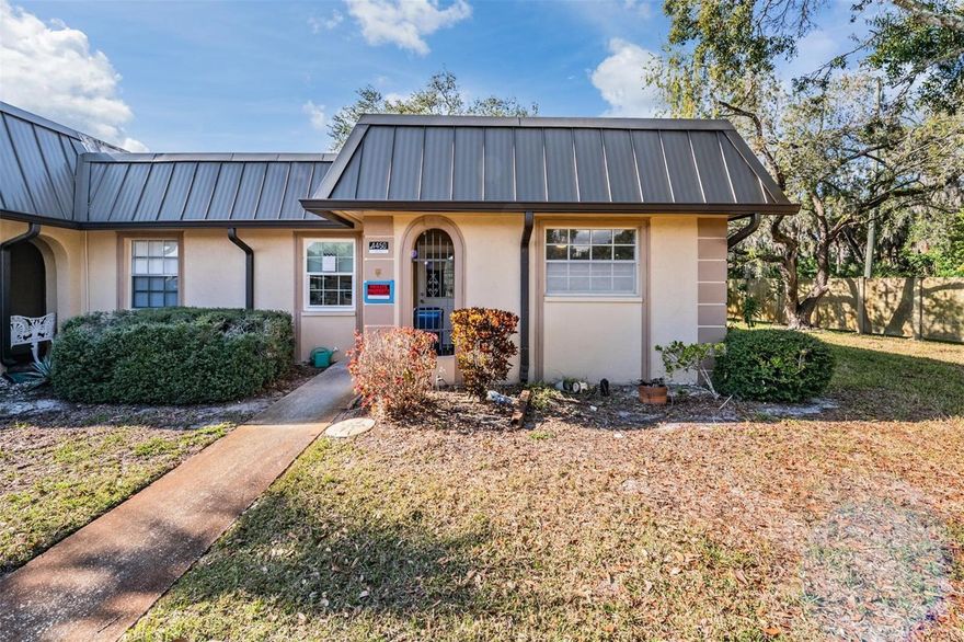 Welcome to 4450 Sunstate Drive in New Port Richey, a charming and completely remodeled 2-bedroom, 2-bathroom villa offering a blend of comfort, space, and low-maintenance living. This light and bright residence features a spacious layout with a large living room, dedicated dining space, and a bonus sunroom ideal for a home office, reading area, or additional lounging space. The kitchen has been thoughtfully updated with modern cabinetry, sleek countertops, stainless steel appliances (2025), and a stylish backsplash, making it both functional and inviting for everyday cooking or entertaining.HVAC 2026 and water heater 2025. All furniture included in sales price! 

The primary bedroom includes a private en-suite bathroom and ample closet space, while the guest bedroom is conveniently located next to a second full bathroom. Newer luxury vinyl plank flooring throughout much of the home enhances the contemporary feel, and updated windows let in plenty of natural light. Enjoy peaceful outdoor living in the private rear patio area, shaded by mature trees and offering a quiet spot for morning coffee or evening relaxation.

This villa also includes a covered carport and access to a shared green space. Located just minutes from the Gulf, local parks, shopping, and dining, this is a perfect opportunity for seasonal residents, first-time buyers, or anyone looking to enjoy the Florida lifestyle in a low-maintenance setting. Don’t miss your chance to make this delightful home your own.