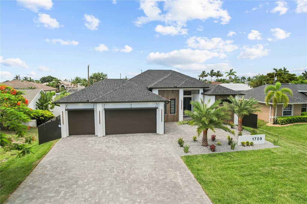 Photo of 1709 SW 43rd Lane, Cape Coral, FL 33914 (MLS # C7527437)